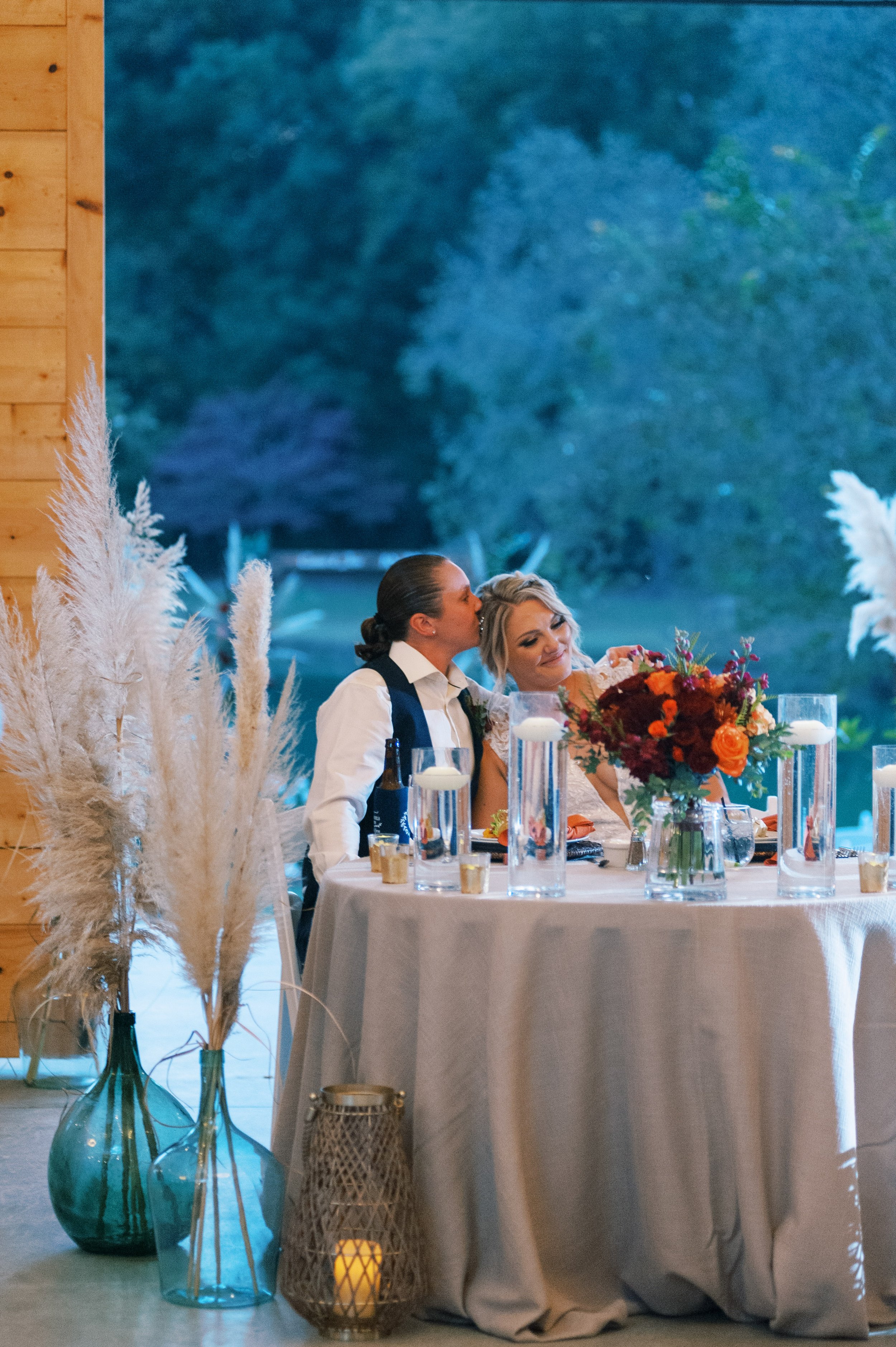 Brides at Sweetheart Table Walnut Hill NC Wedding Venue Fancy This Photography