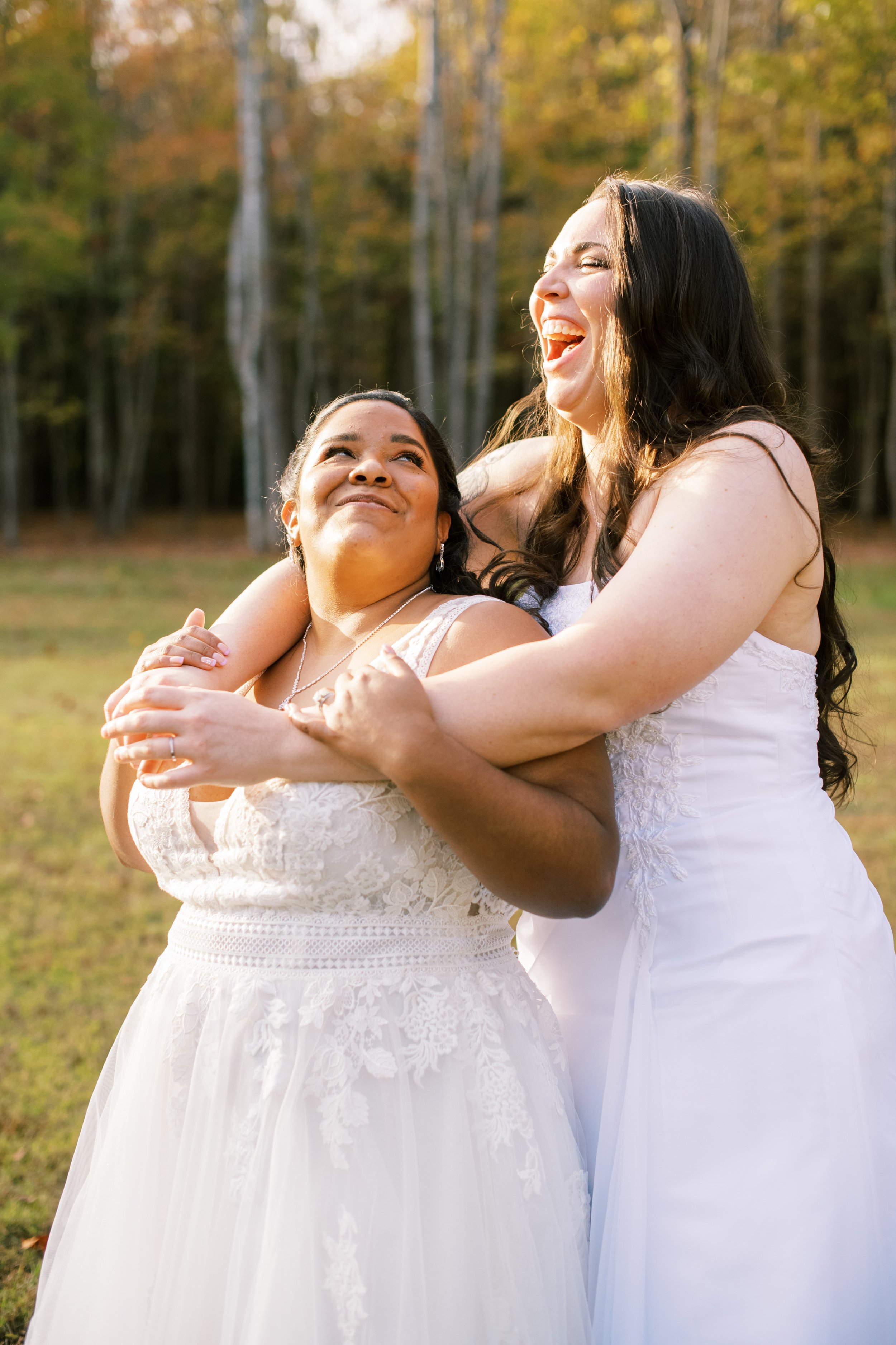 Brides Hold Each Other Beautiful Mebane NC Wedding in Family's Backyard Fancy This Photography