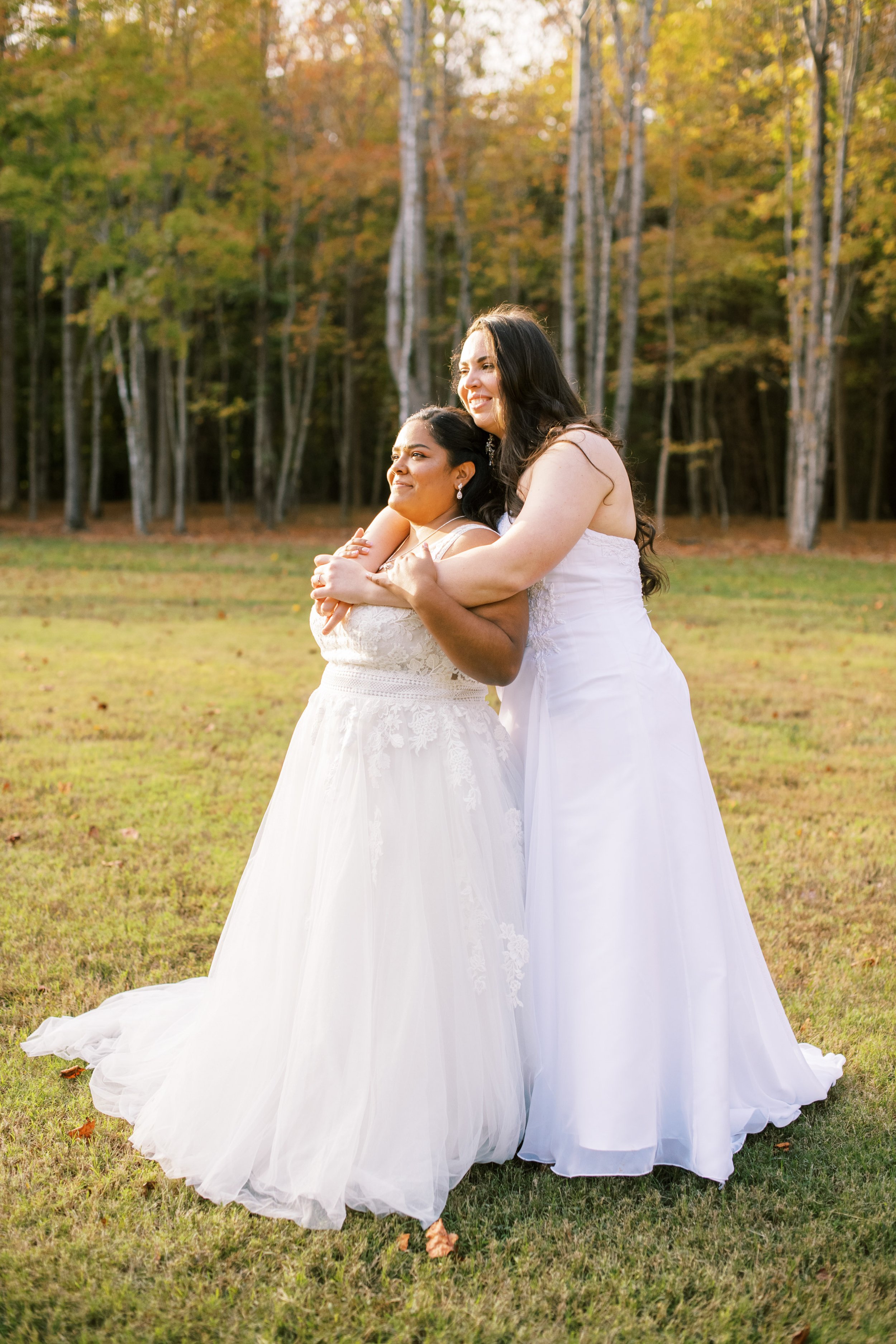 Brides Holding Each Other Beautiful Mebane NC Wedding in Family's Backyard Fancy This Photography