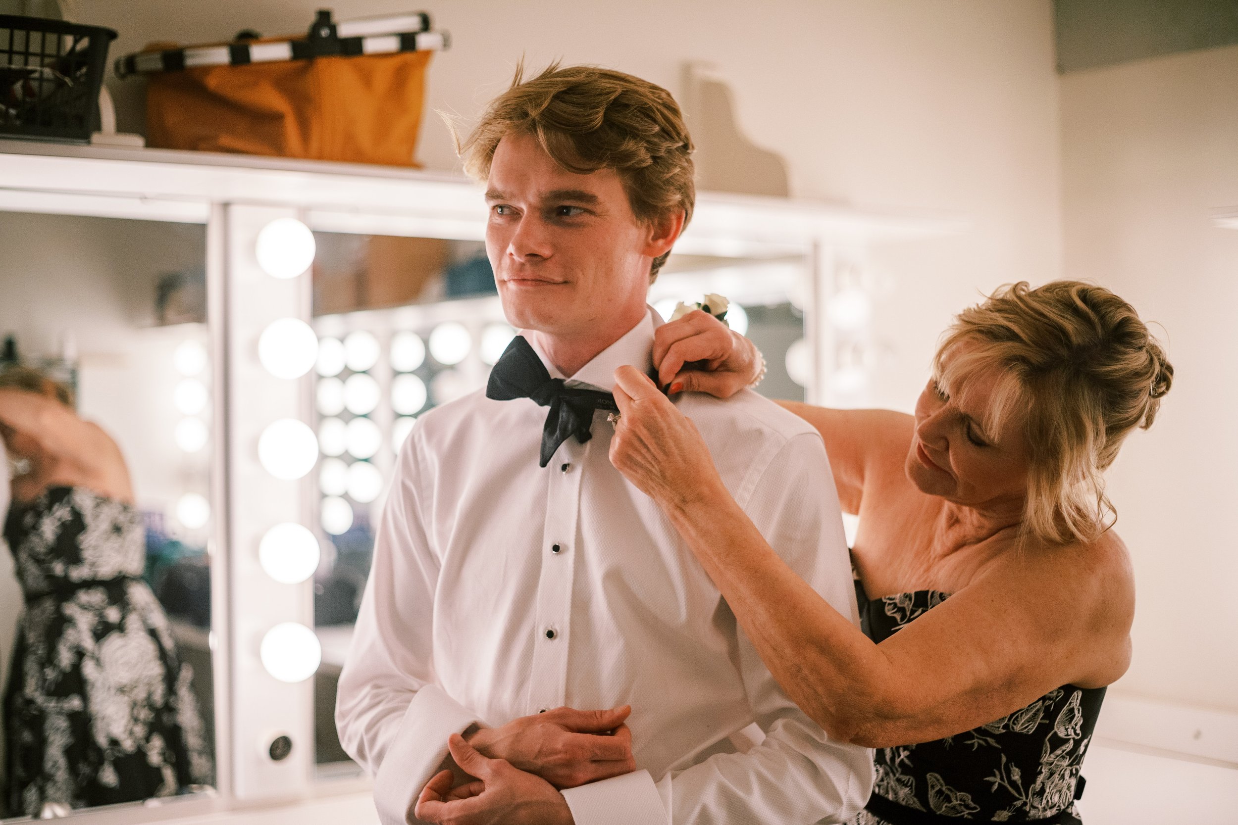 Mother Helps Groom Bow Tie Salisbury North Carolina Wedding at The Meroney Theater Fancy This Photography