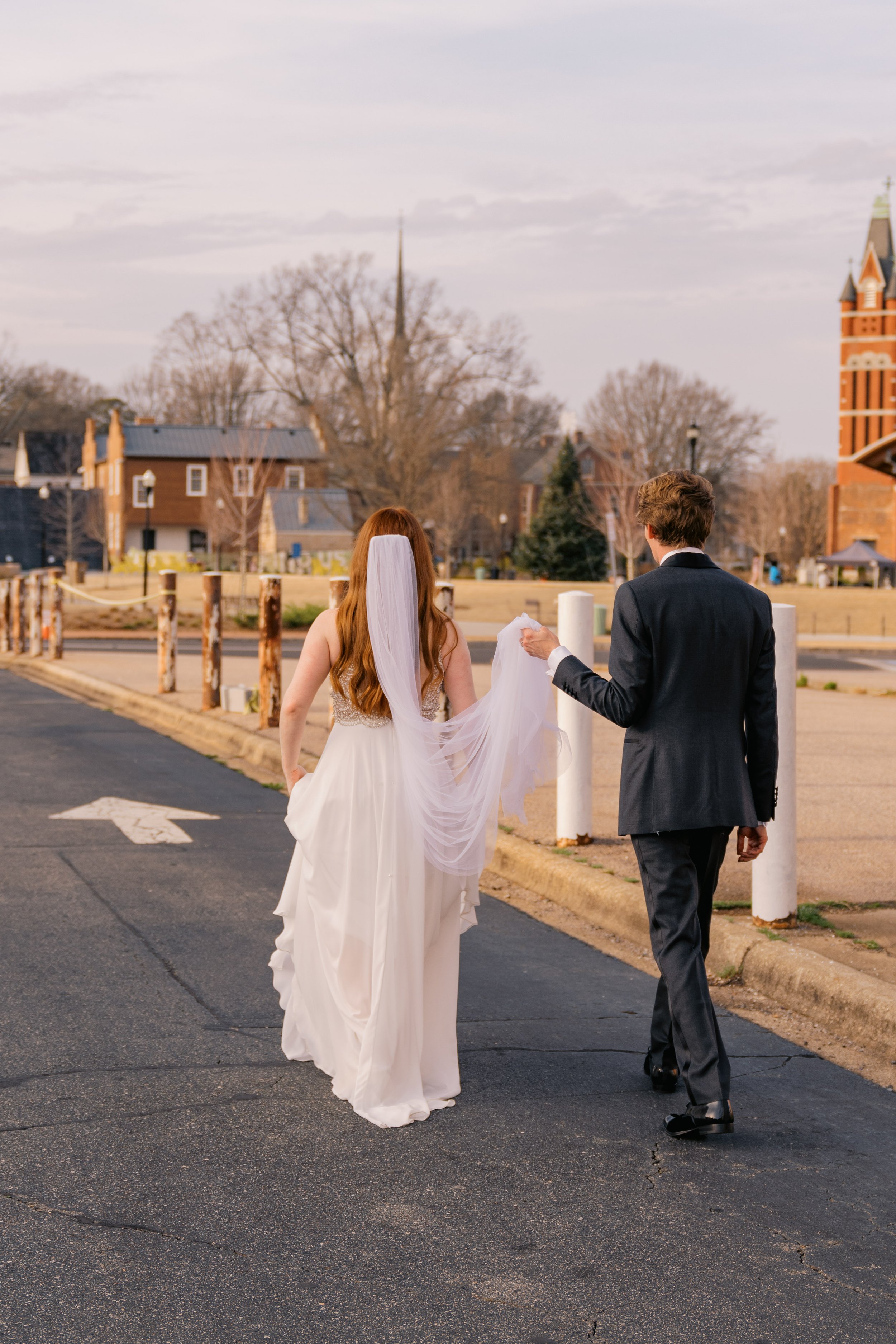 Bride and Groom Stroll Historic Downtown Salisbury North Carolina Wedding at The Meroney Theater   Fancy This Photography