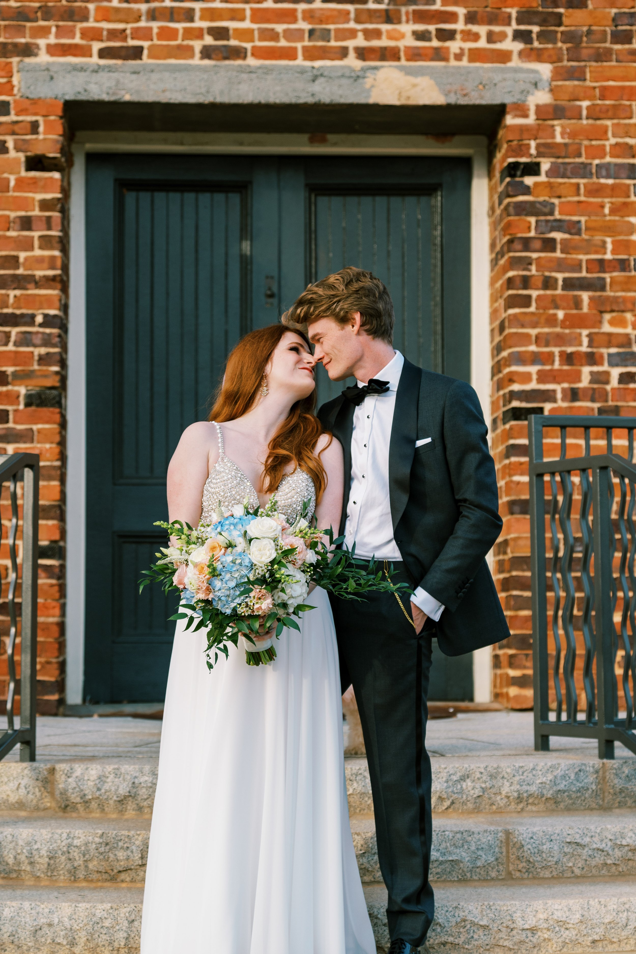 Bride and Groom Kiss Historic Downtown Salisbury North Carolina Wedding at The Meroney Theater  Fancy This Photography