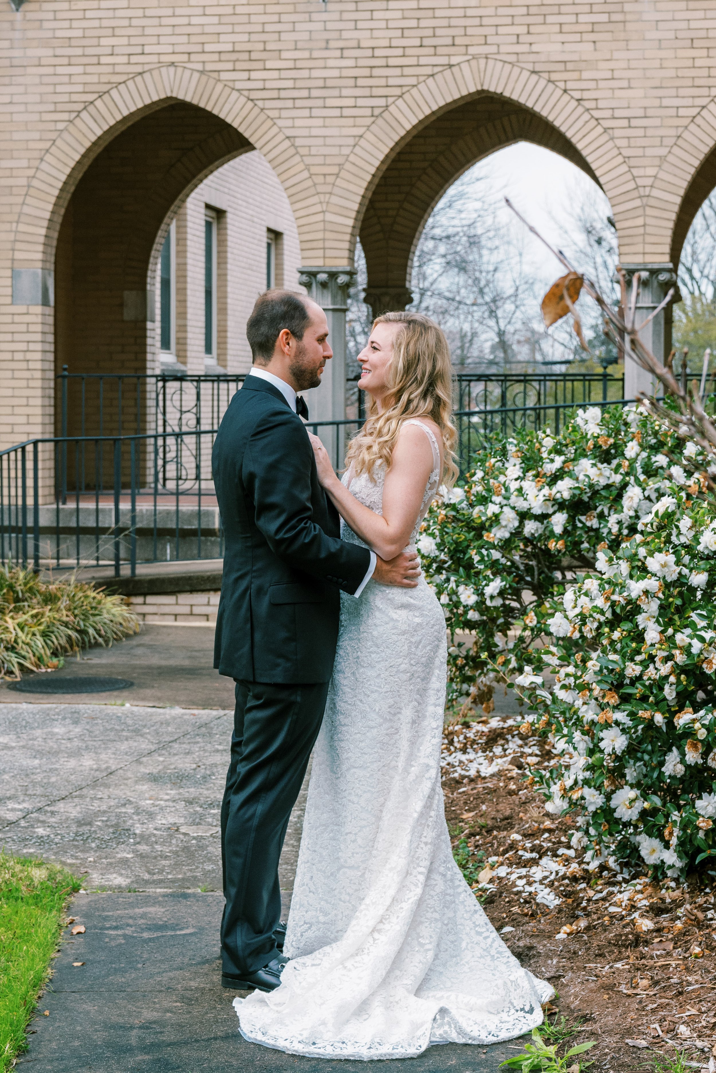 Bride with Groom Duke Memorial Church Wedding at The Cotton Room Durham NC Fancy This Photography