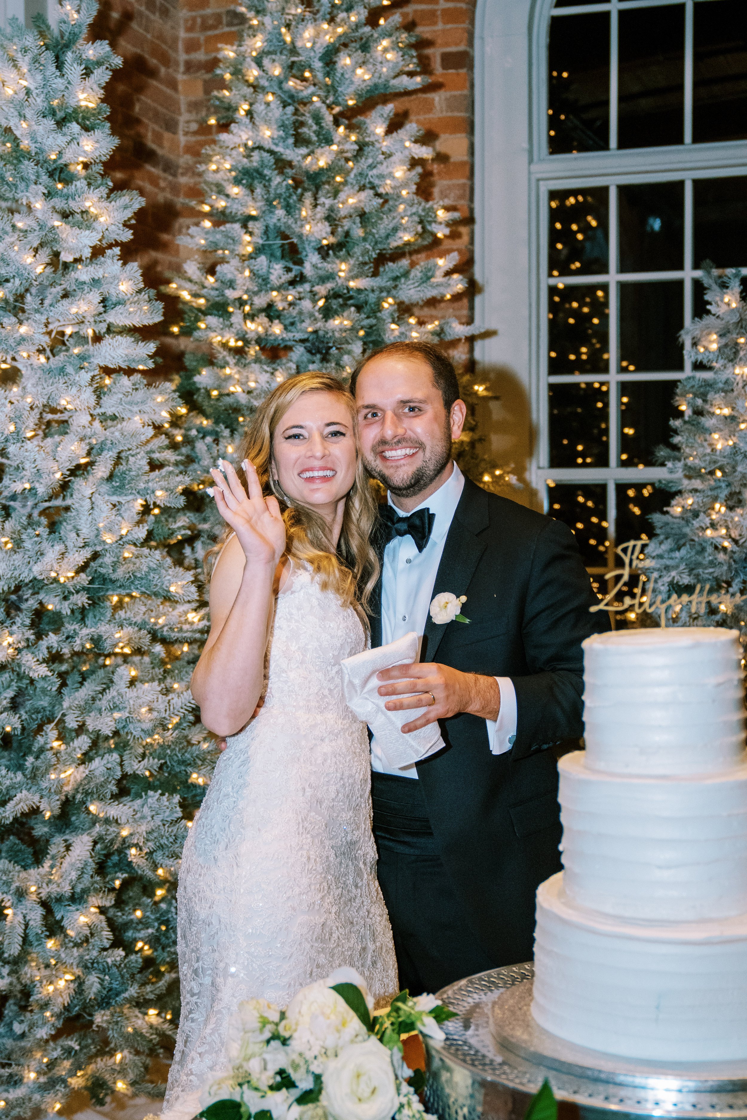 Bride and groom with cake Wedding at The Cotton Room Durham NC Fancy This Photography
