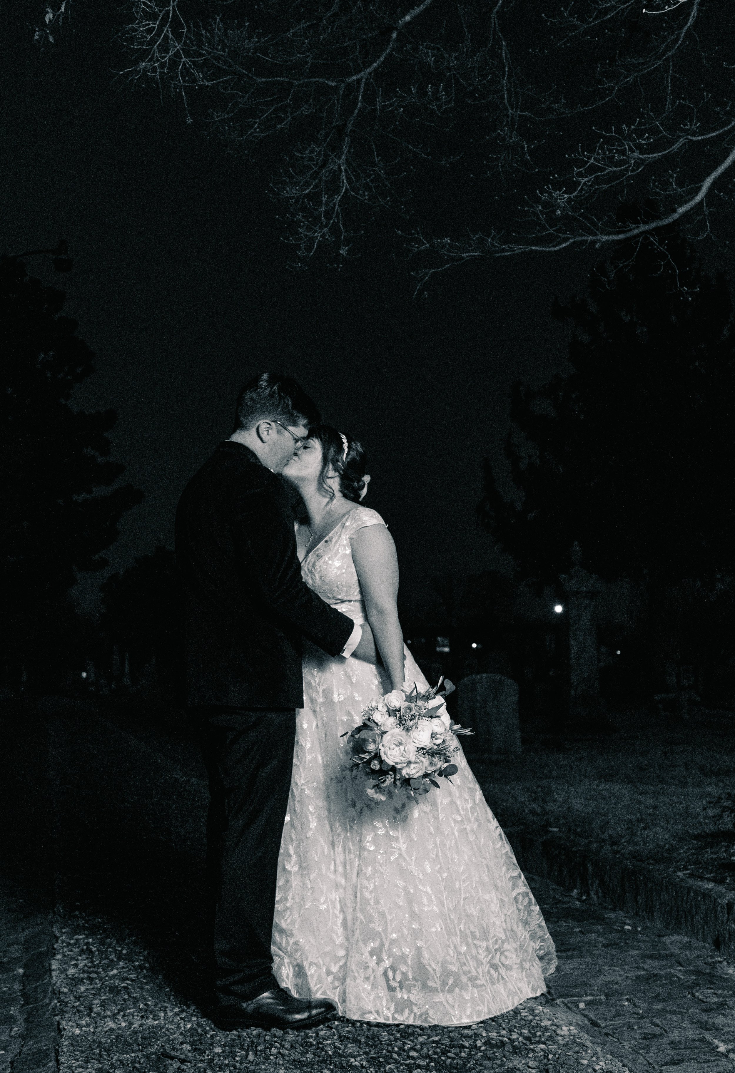 Nighttime Kiss Bride and Groom Wedding at All Saints Chapel Raleigh NC Fancy This Photography