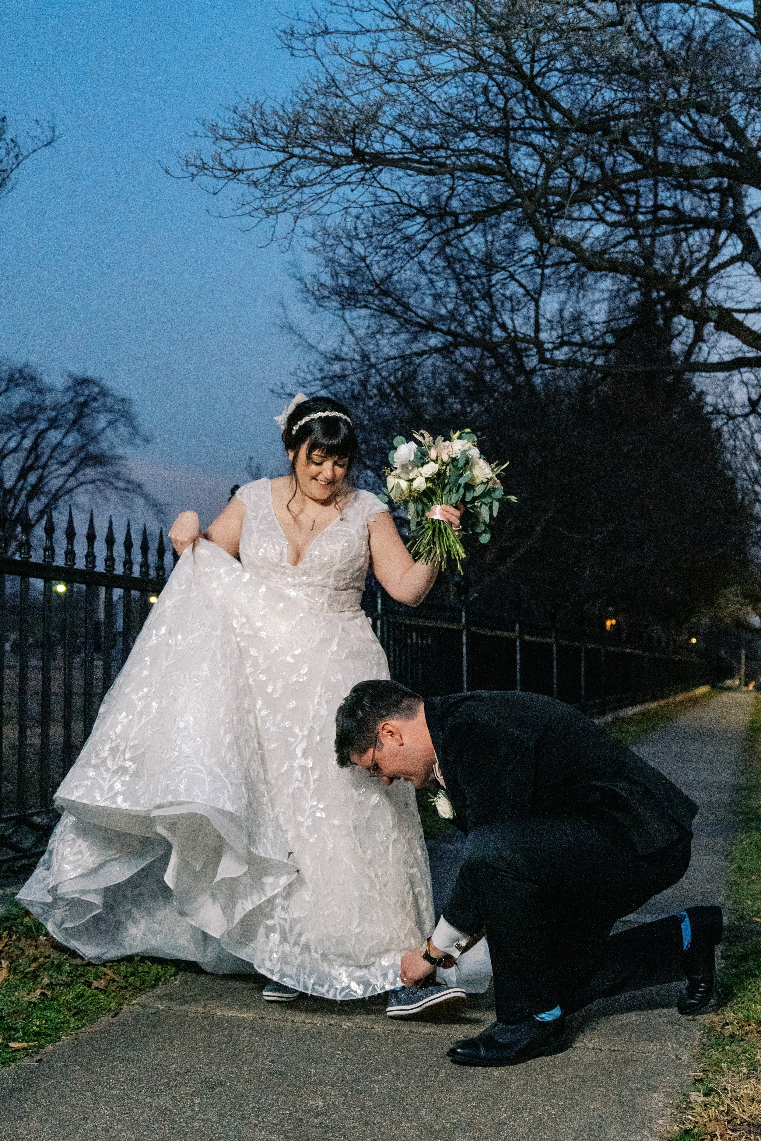Groom Ties Bride's Shoe Wedding at All Saints Chapel Raleigh NC Fancy This Photography