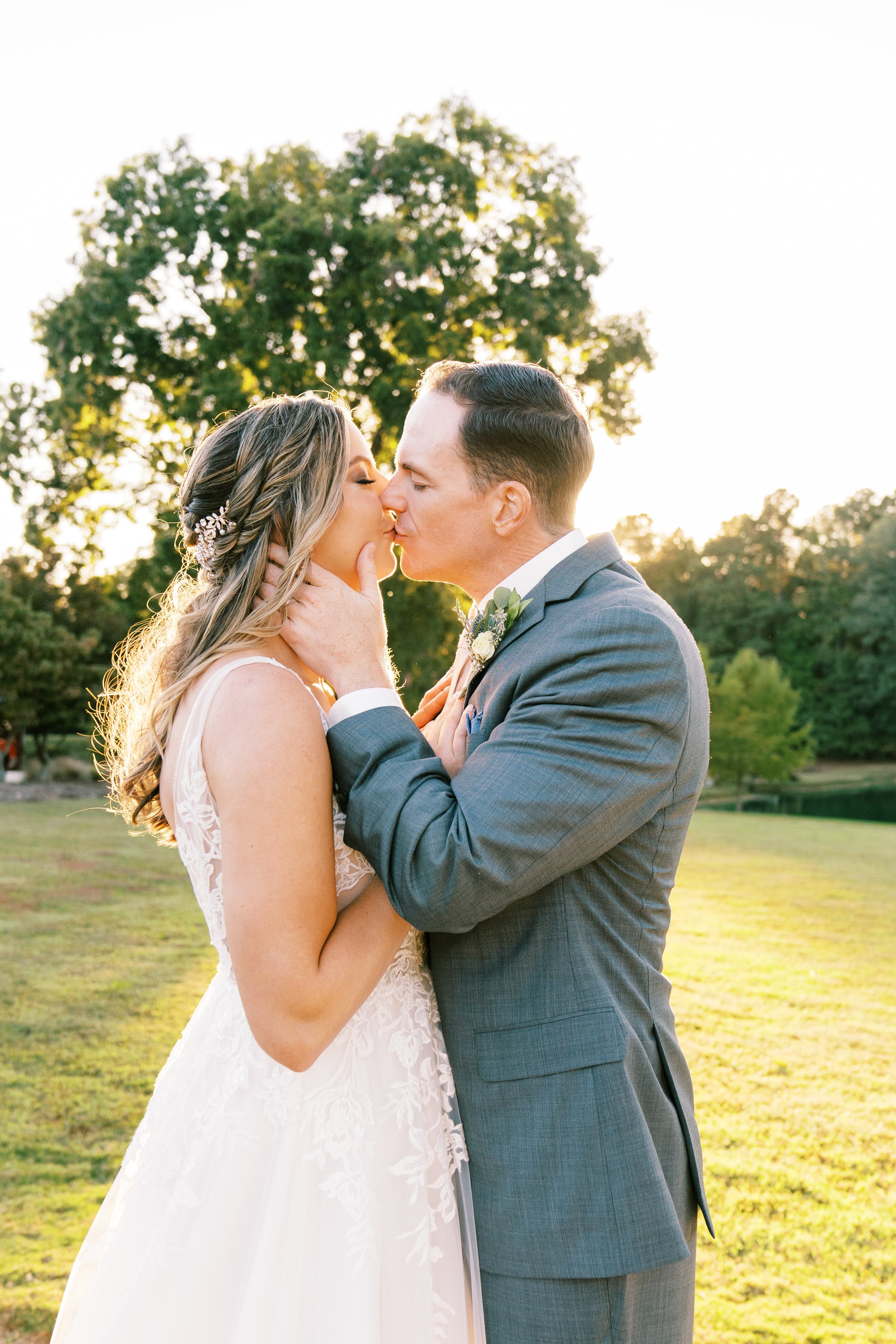 Golden Hour Bride and Groom Kiss Walnut Hill Wedding Venue Fancy This Photography