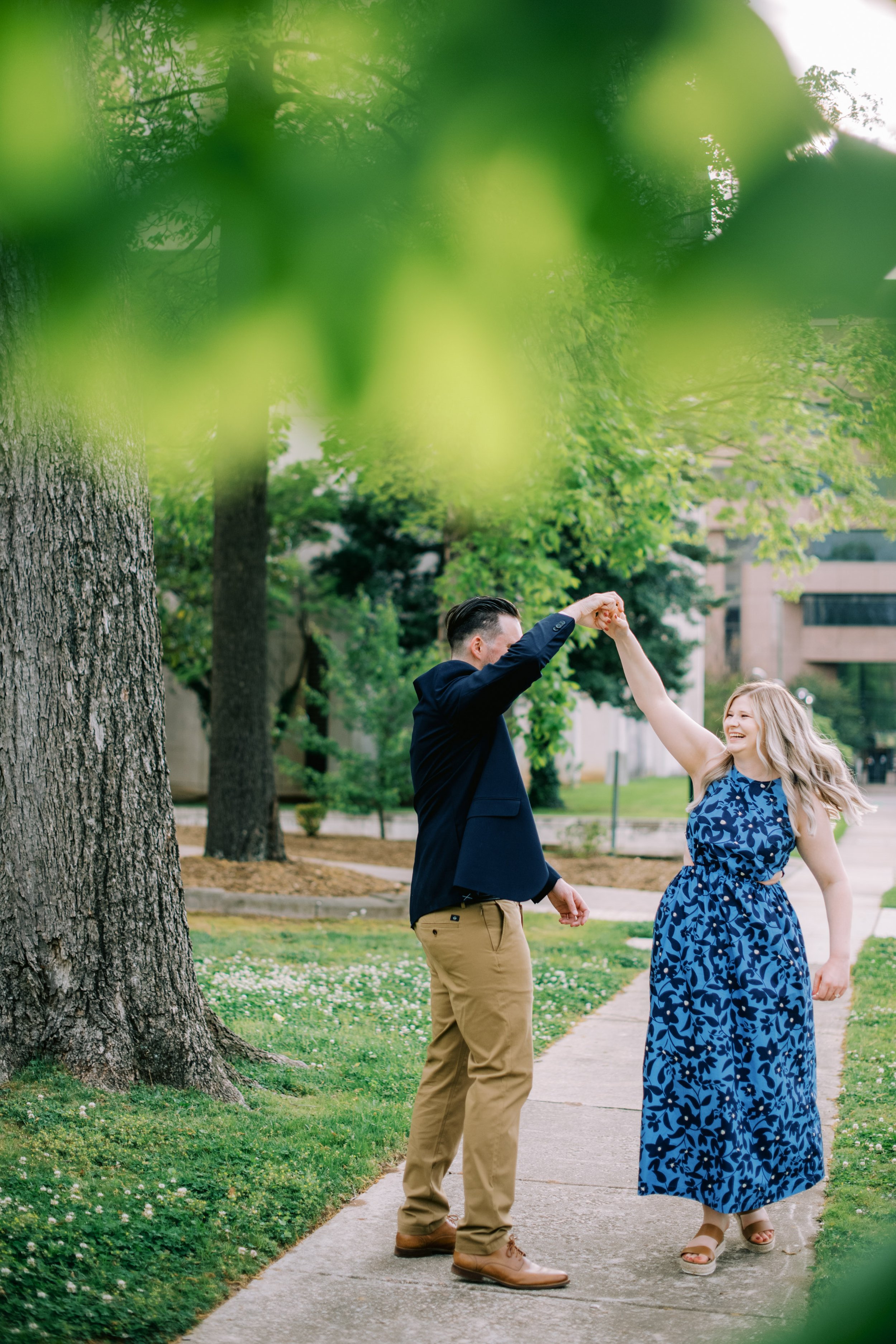 Victoria and Cody Sidewalk Dance Raleigh NC Engagement Photos in Historic Oakwood Neighborhood Fancy This Photography