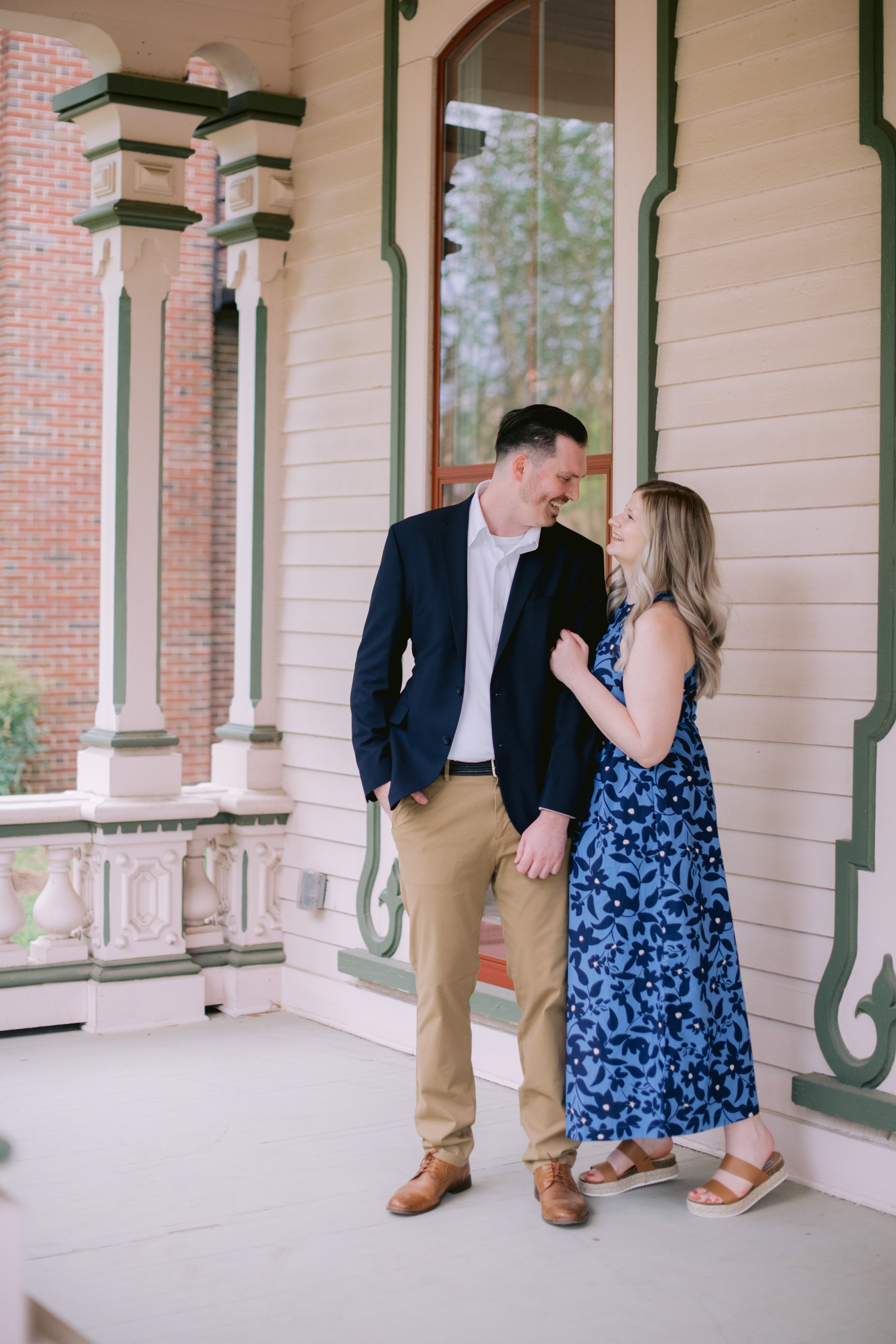 Victoria and Cody Front Porch Pose Downtown Raleigh NC Engagement Photos in Historic Oakwood Neighborhood Fancy This Photography