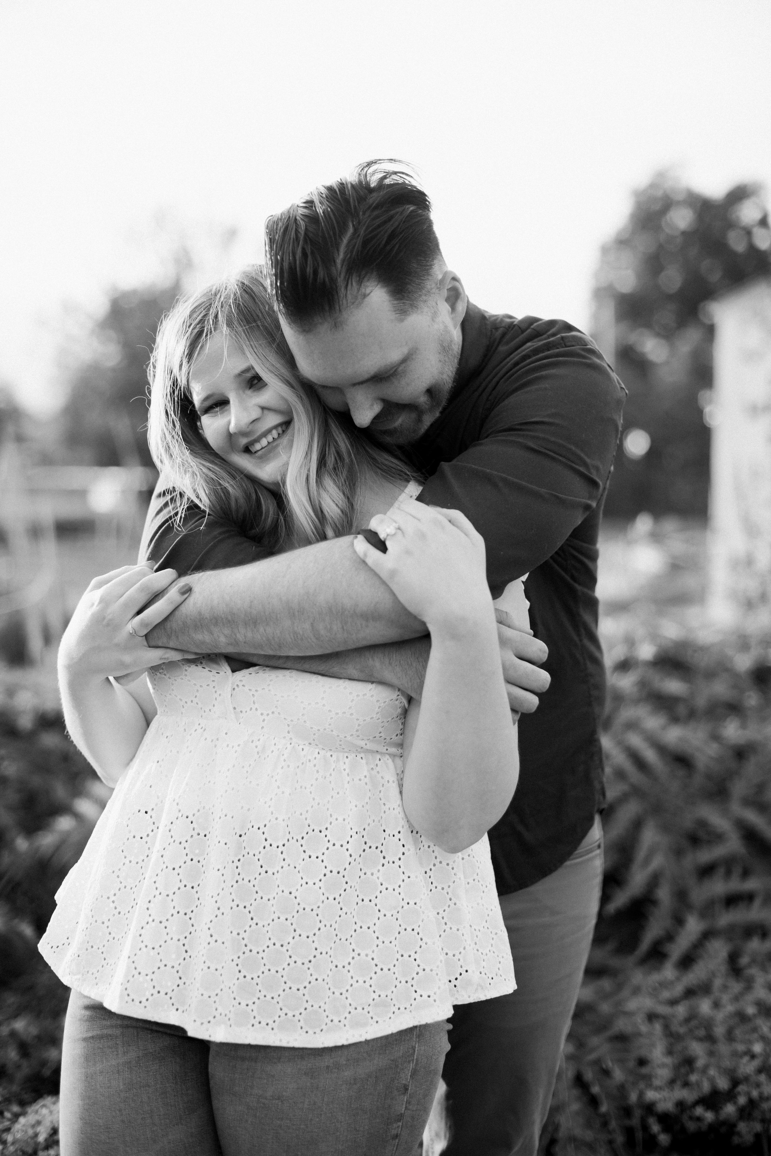 Black and White Embrace in Raleigh Rose Garden Raleigh NC Engagement Photos in Historic Oakwood Neighborhood Fancy This Photography