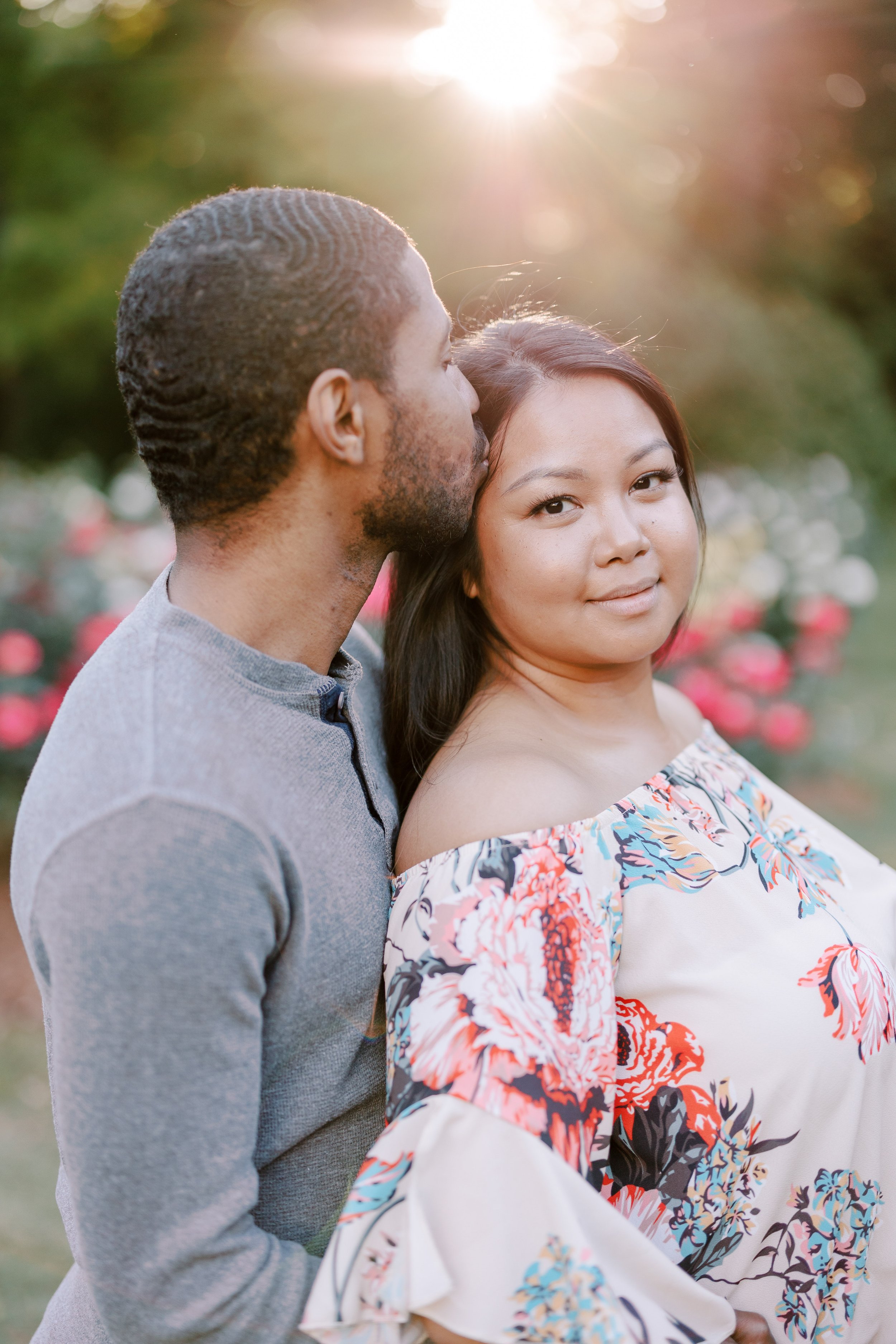 Forehead Kiss Engagement Photos in The Raleigh Rose Garden Fancy This Photography