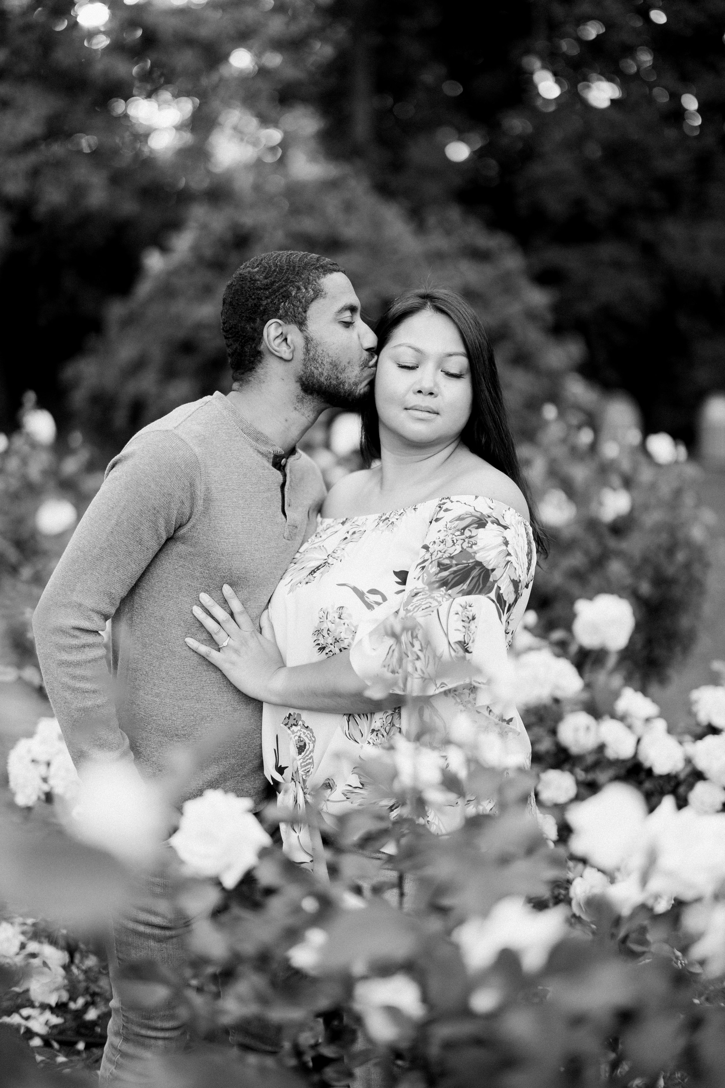 Black and White Imagery Couple in Engagement Photos in The Raleigh Rose Garden Fancy This Photography