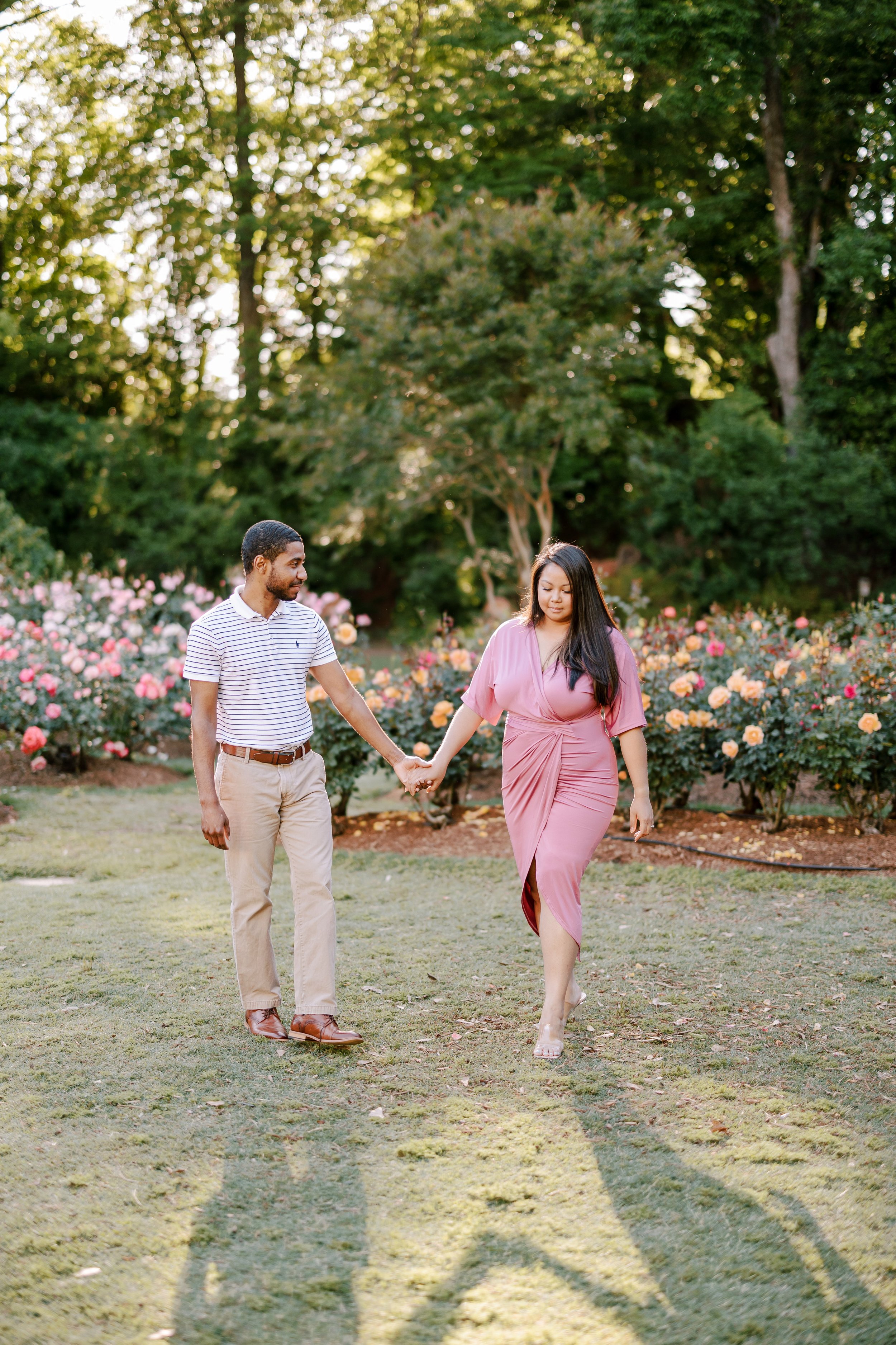 Walking Engagement Photos in The Raleigh Rose Garden Fancy This Photography