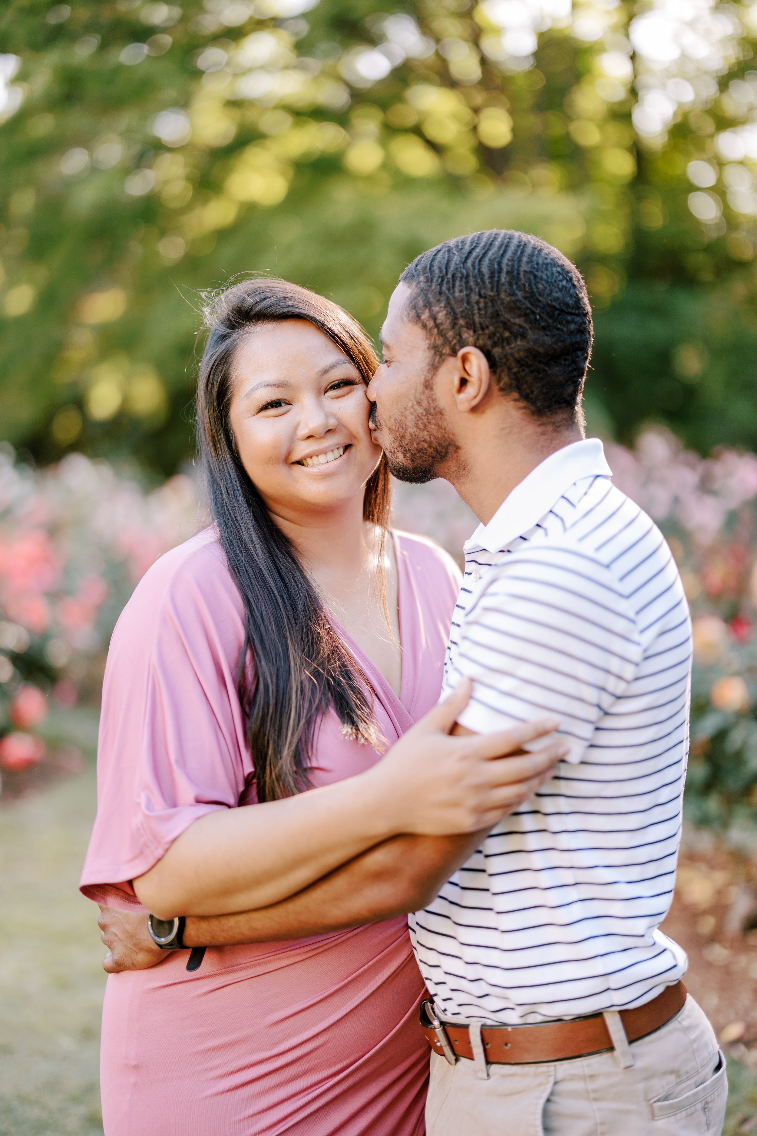 Colorful Image Cheek Kisses Engagement Photos in The Raleigh Rose Garden Fancy This Photography