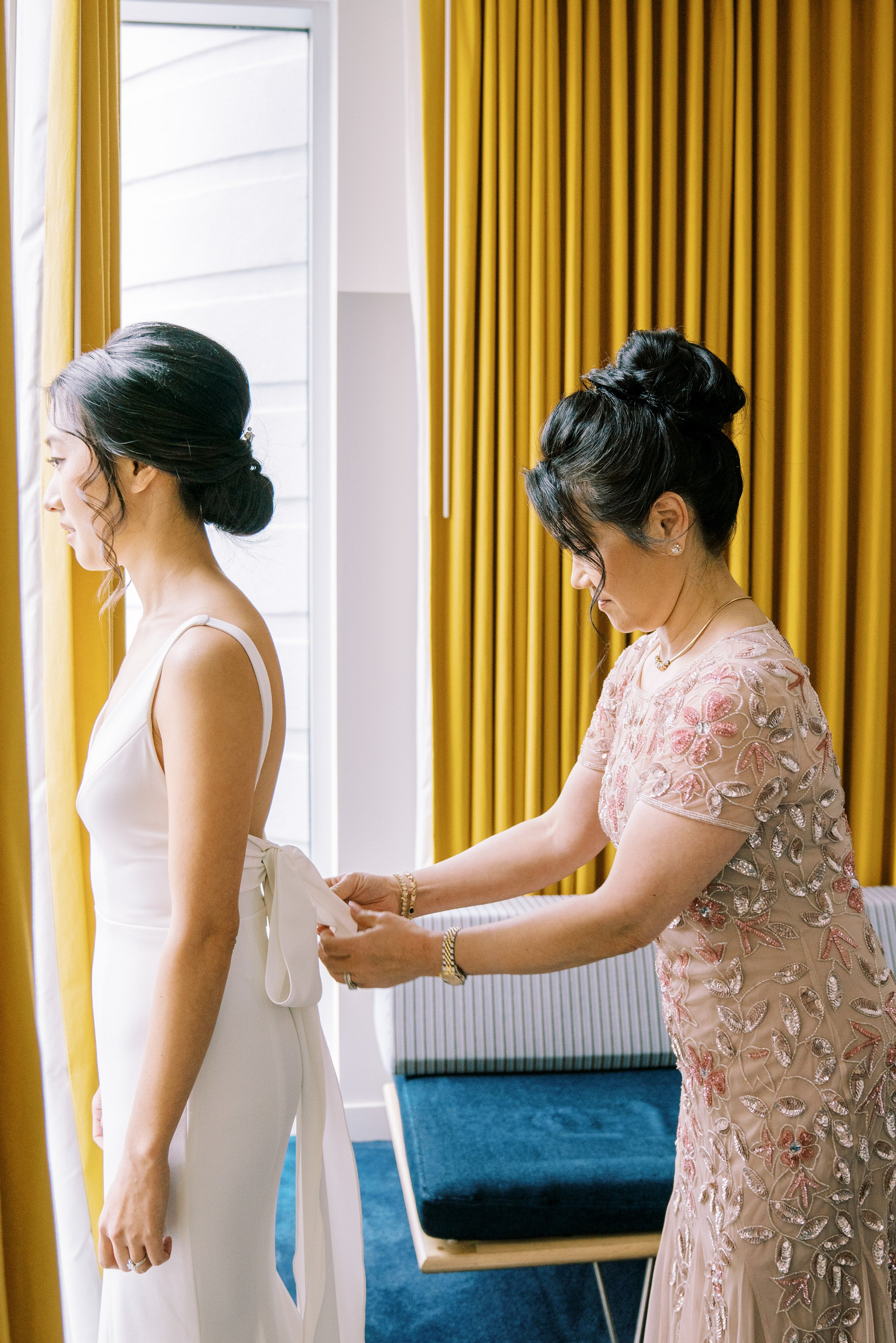 Mother Helps Daughter Get Dressed Durham Hotel Wedding at Bay 7 Durham NC Fancy This Photography