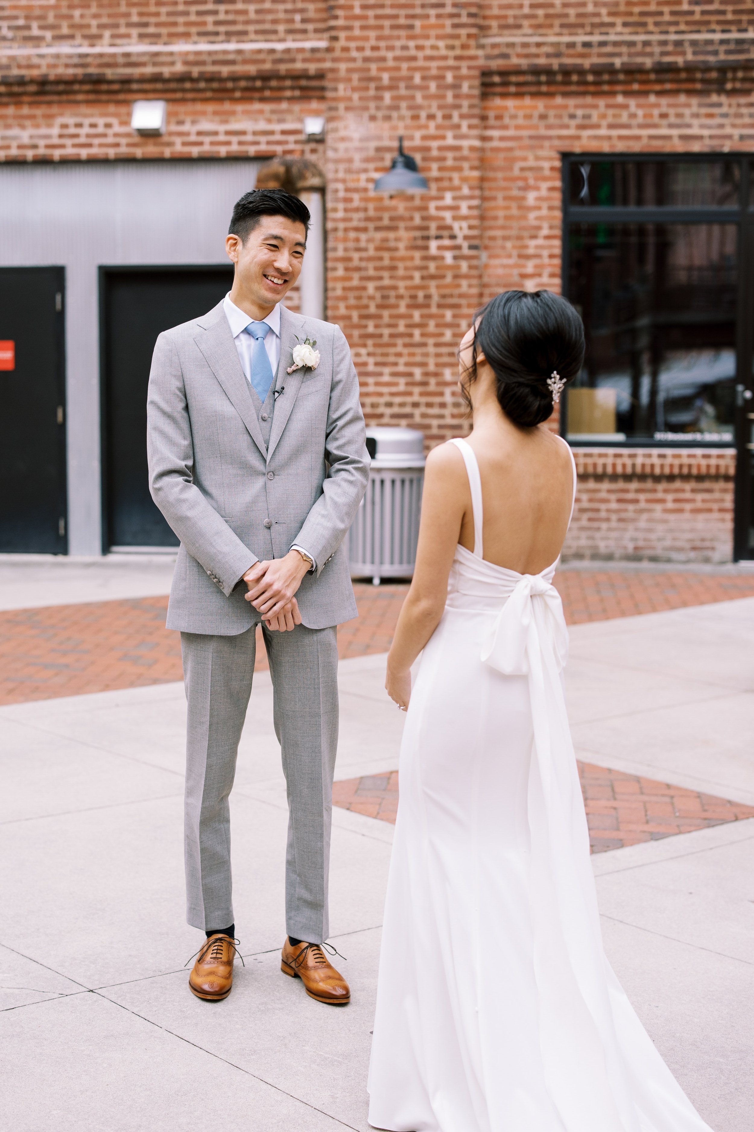 First Look Reaction Groom American Tobacco Campus Wedding at Bay 7 Durham NC Fancy This Photography