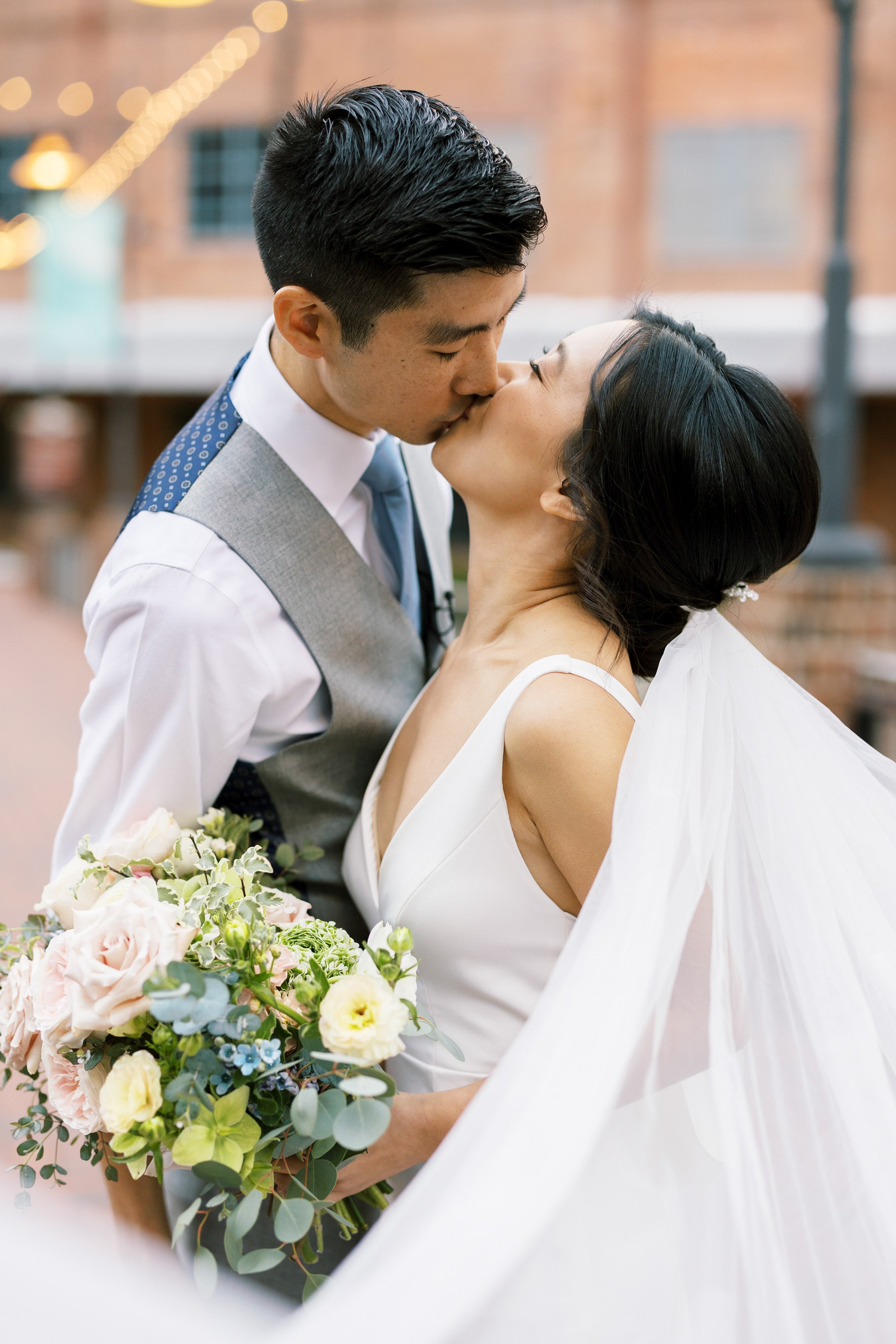 Dramatic Kiss Bride and Groom American Tobacco Campus Wedding at Bay 7 Durham NC Fancy This Photography