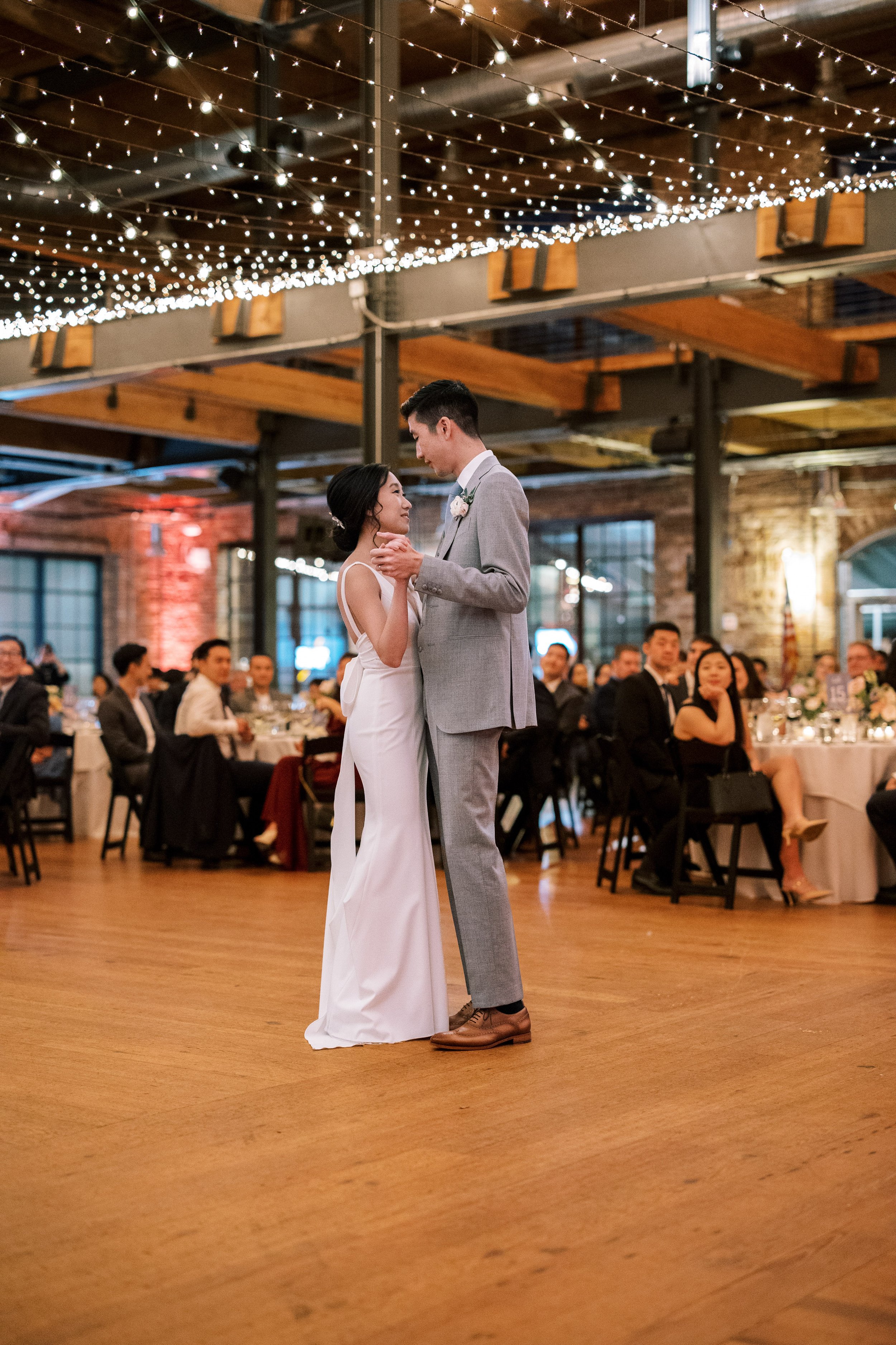 First Dance Under Twinkle Lights Bride Groom Wedding at Bay 7 Durham NC Fancy This Photography