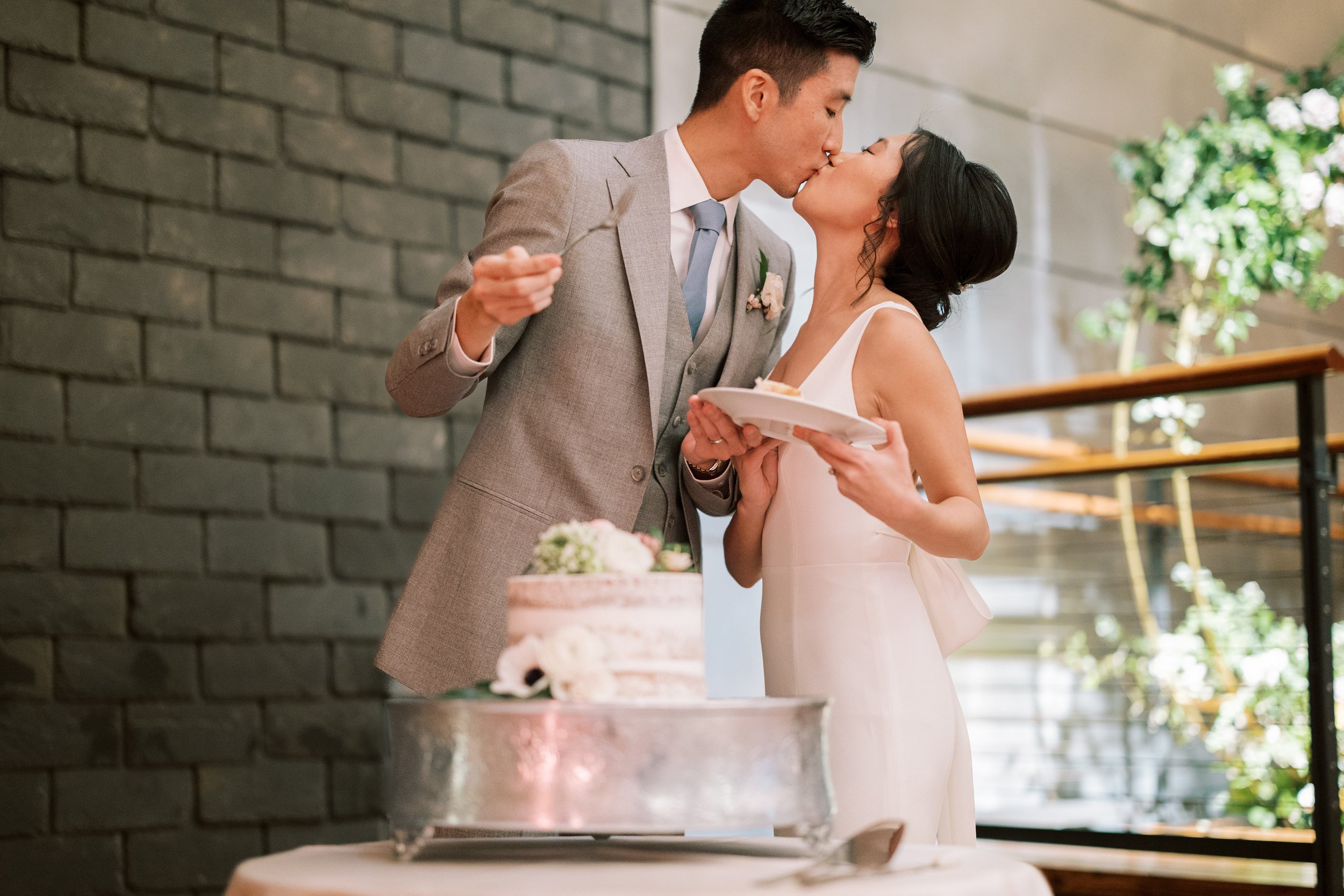 Cake Kiss Bride and Groom Wedding at Bay 7 Durham NC Fancy This Photography