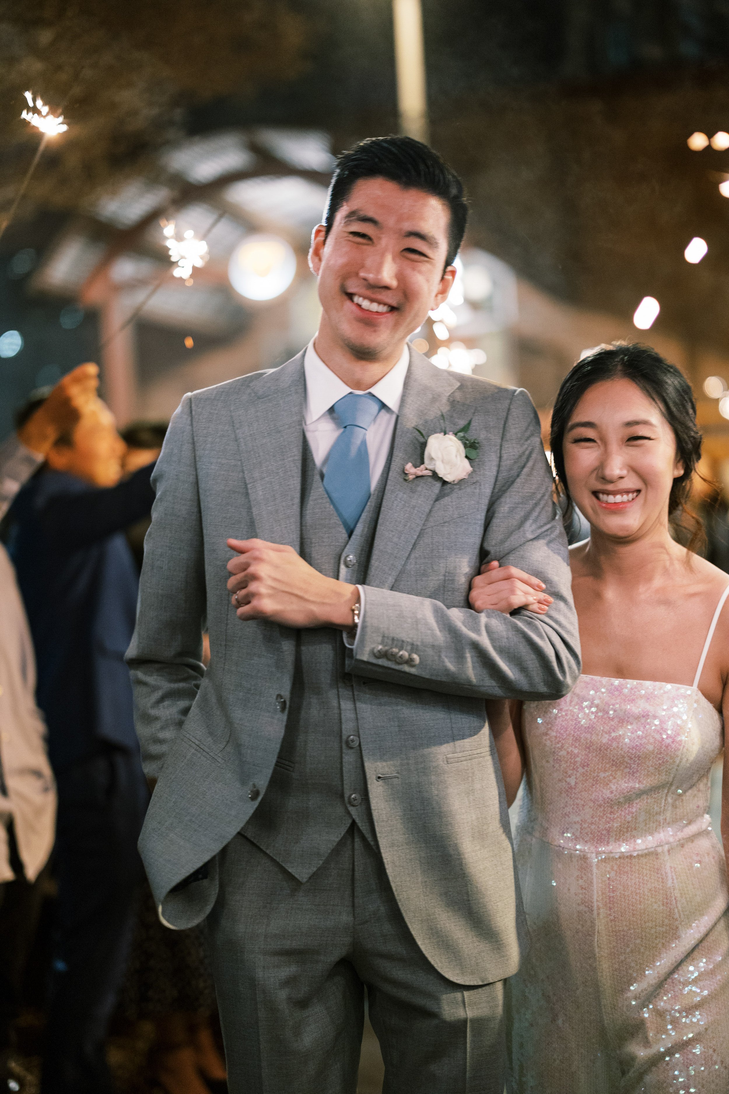 Bride and Groom Smile Sparkler Exit Wedding at Bay 7 Durham NC Fancy This Photography