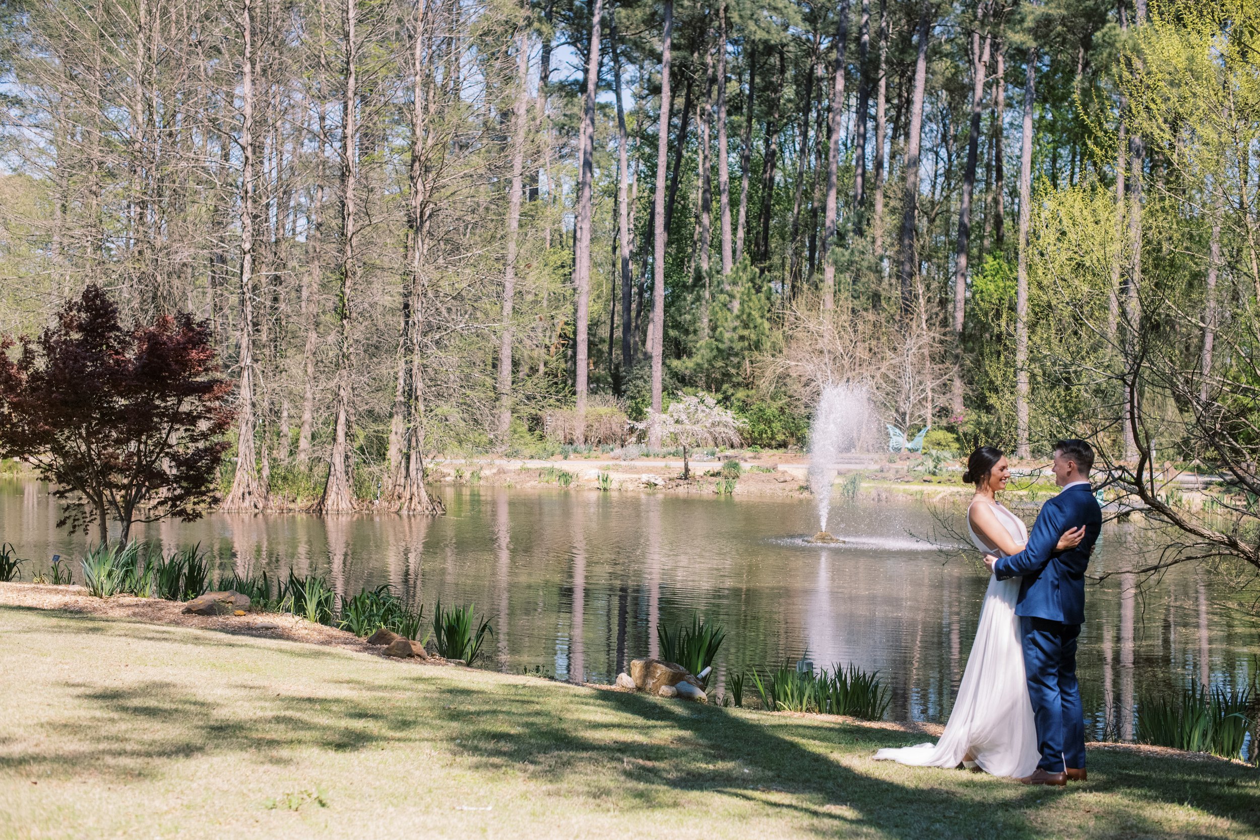 Pond Embrace Bride and Groom Cape Fear Botanical Garden Wedding Fancy This Photography