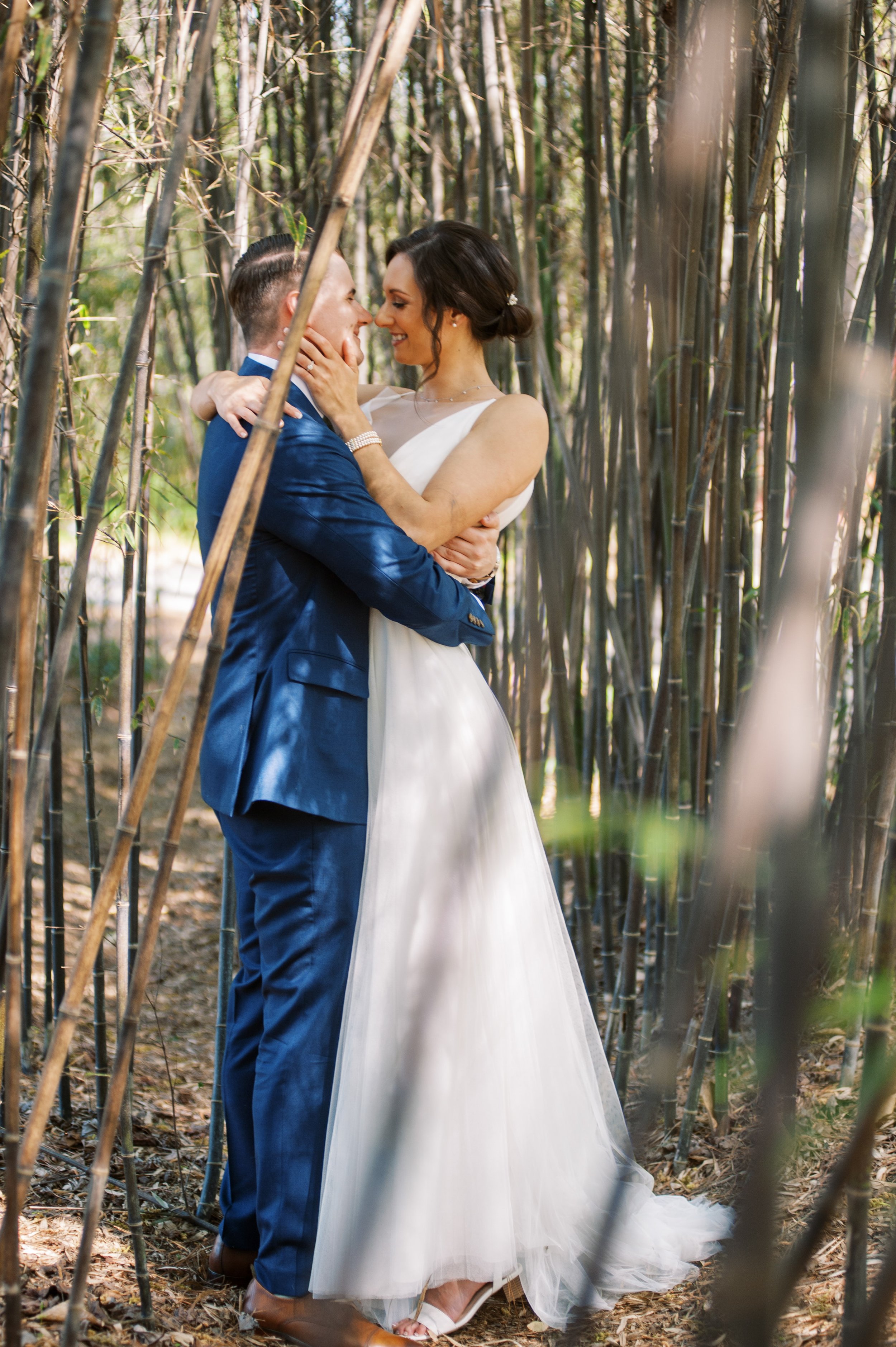 Bride and Groom in Bamboo Trees Cape Fear Botanical Garden Wedding Fancy This Photography