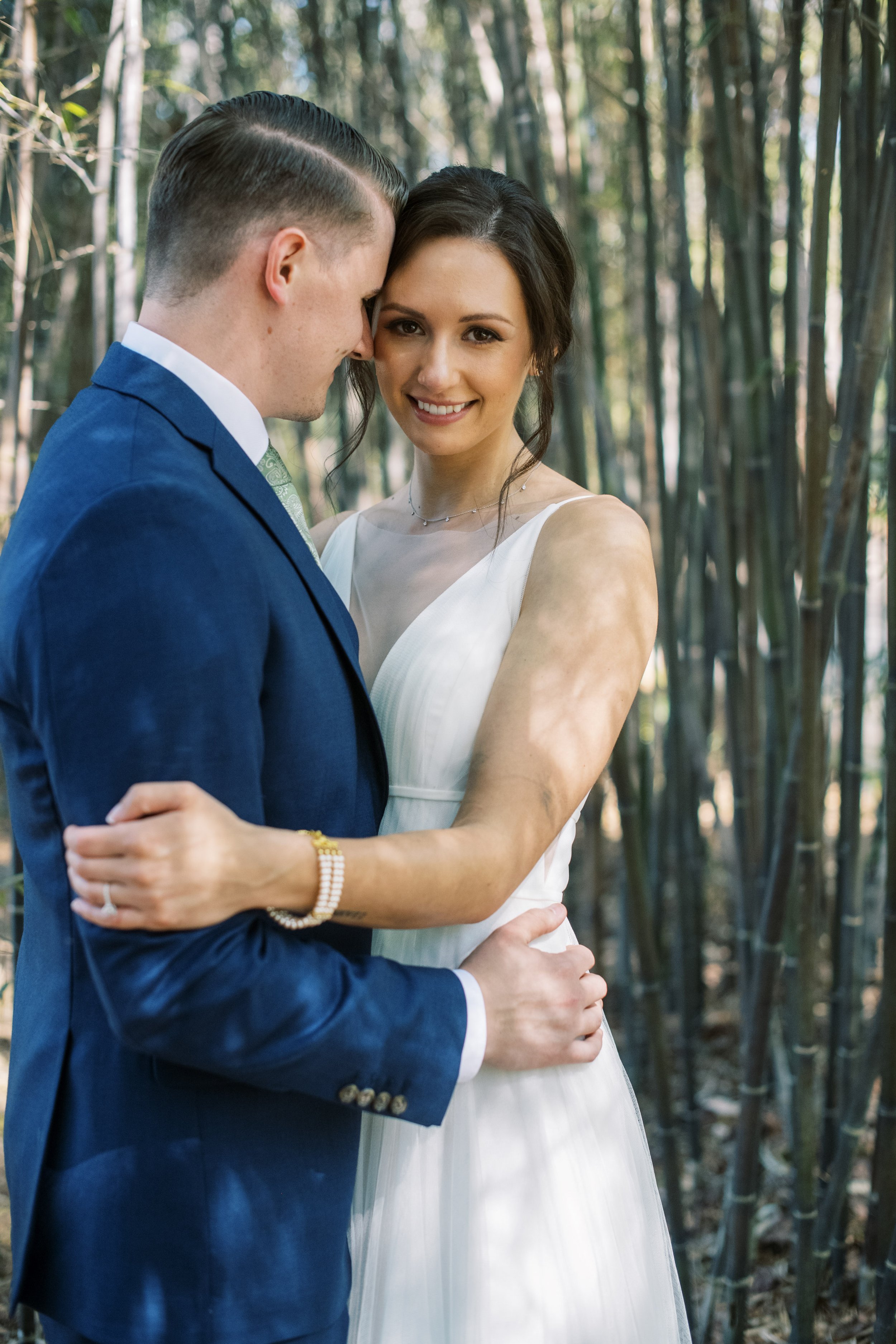 Flirty Bride and Groom in Bamboo Trees Cape Fear Botanical Garden Wedding Fancy This Photography