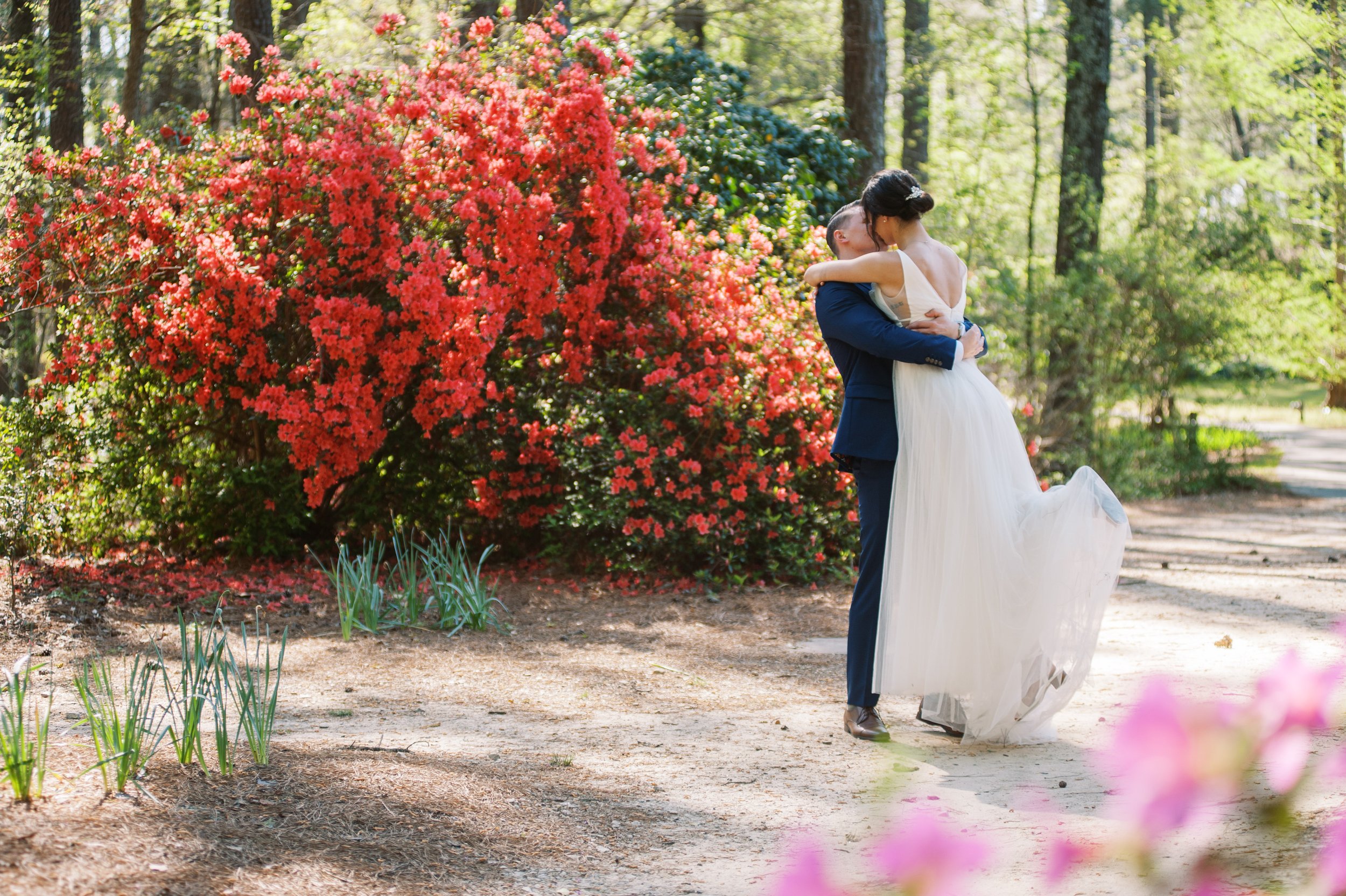 Bride and Groom Pink Azalea Flowers Horizontal Cape Fear Botanical Garden Wedding Fancy This Photography