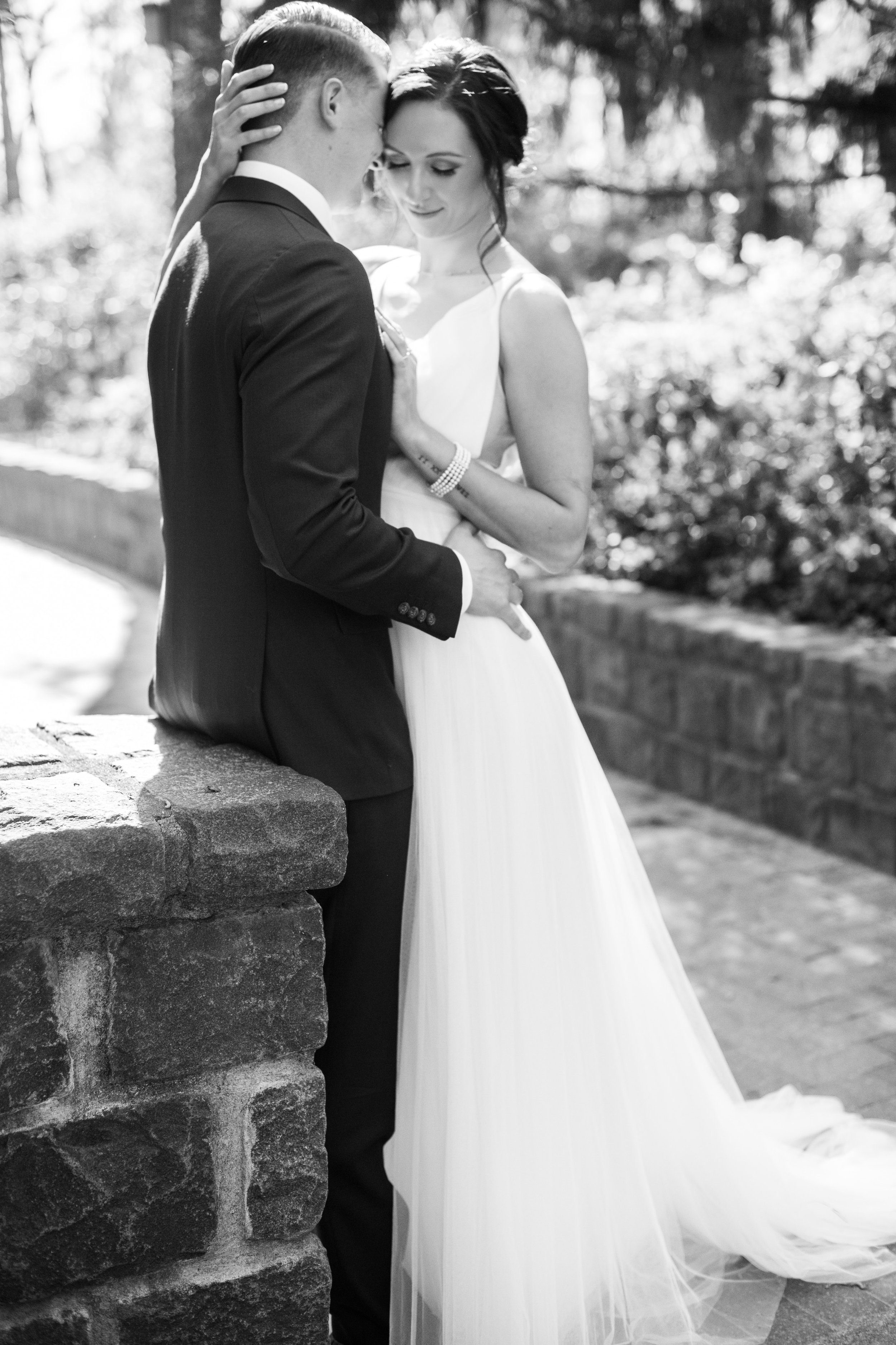 Black and White Bride Groom Golden Hour Stone Wall Cape Fear Botanical Garden Wedding Fancy This Photography