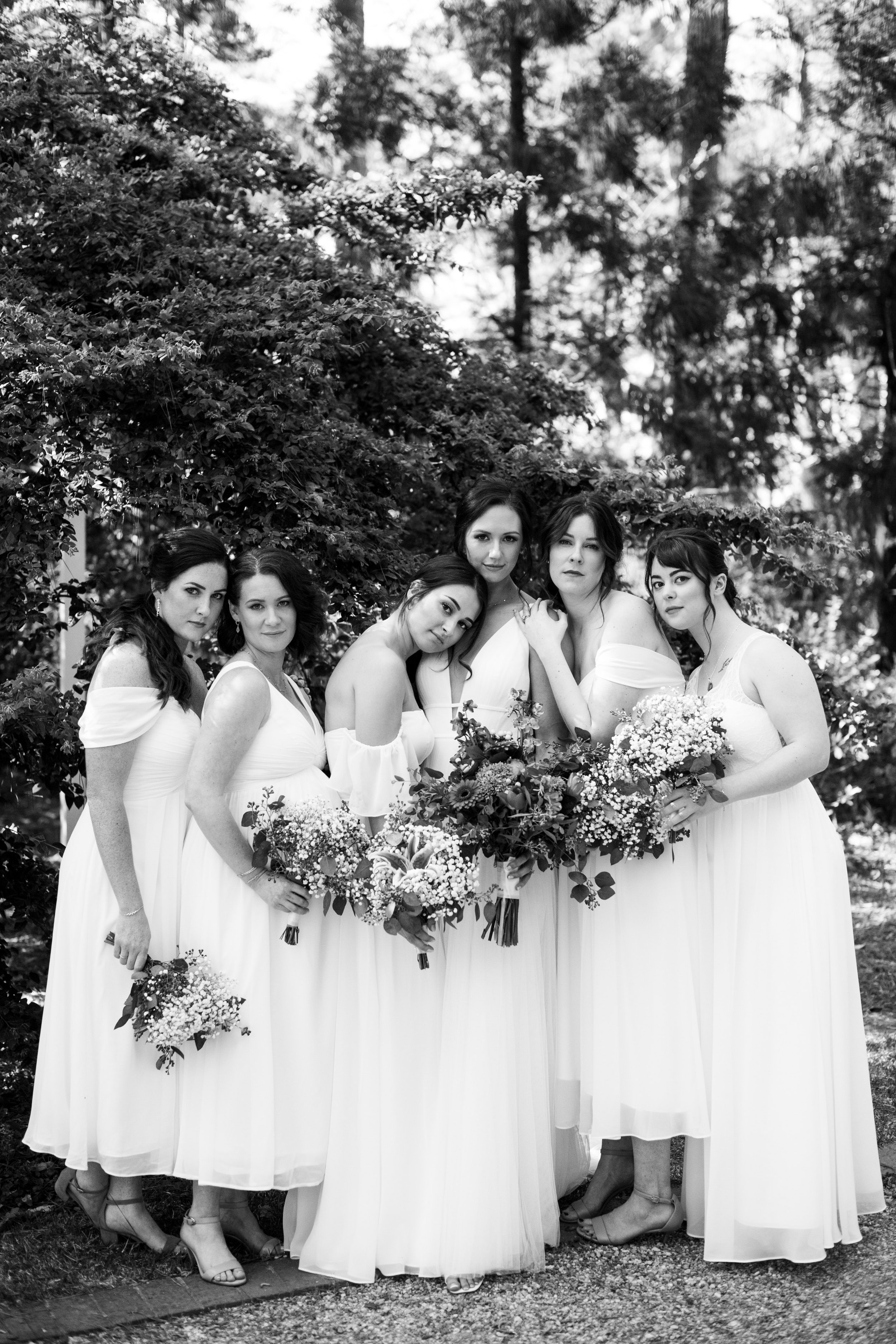 Black and White Bridesmaids in White Dresses Cape Fear Botanical Garden Wedding Fancy This Photography