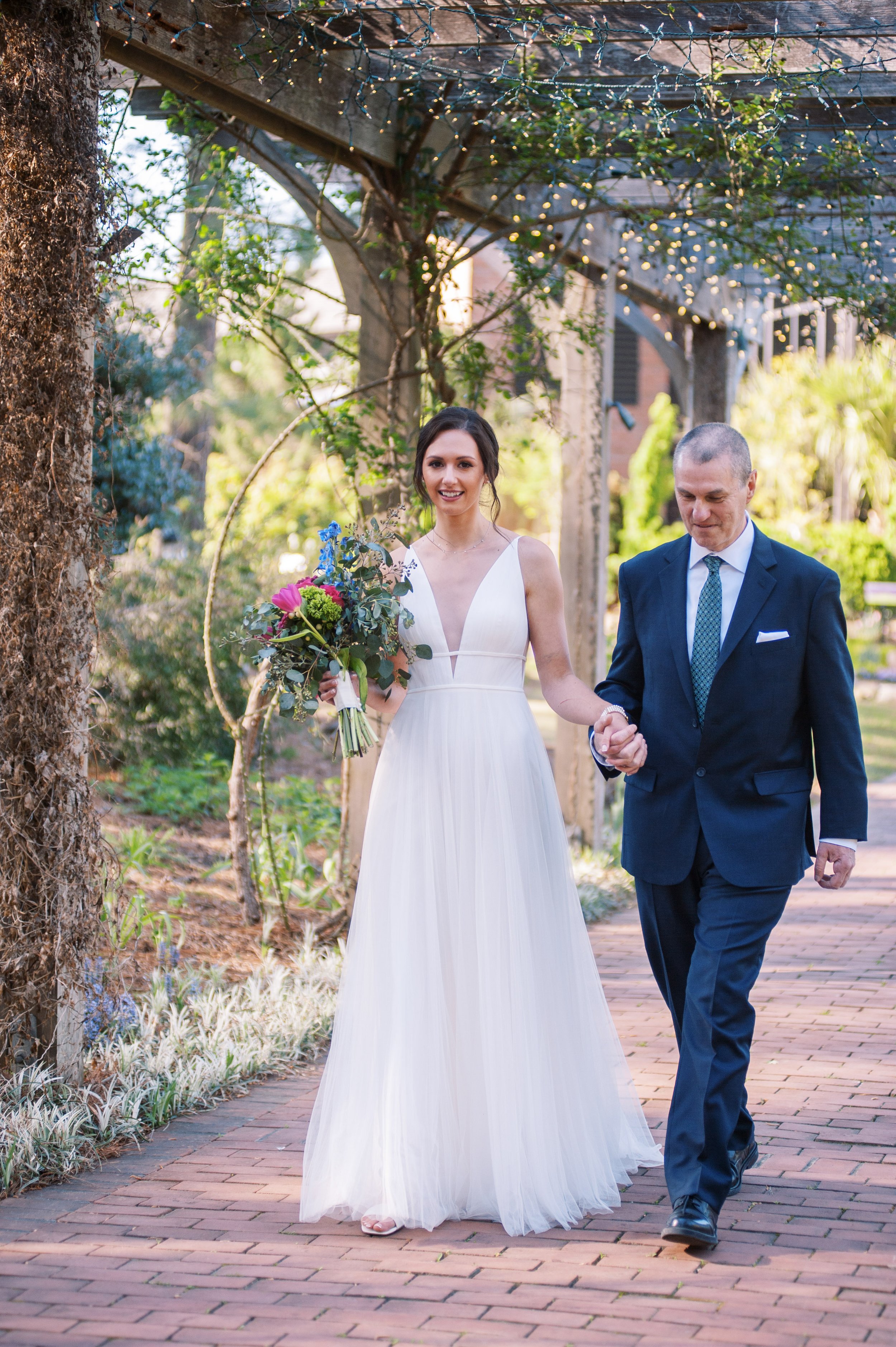 Bride Walks Down Aisle Brick Circle Arboretum Cape Fear Botanical Garden Wedding Fancy This Photography