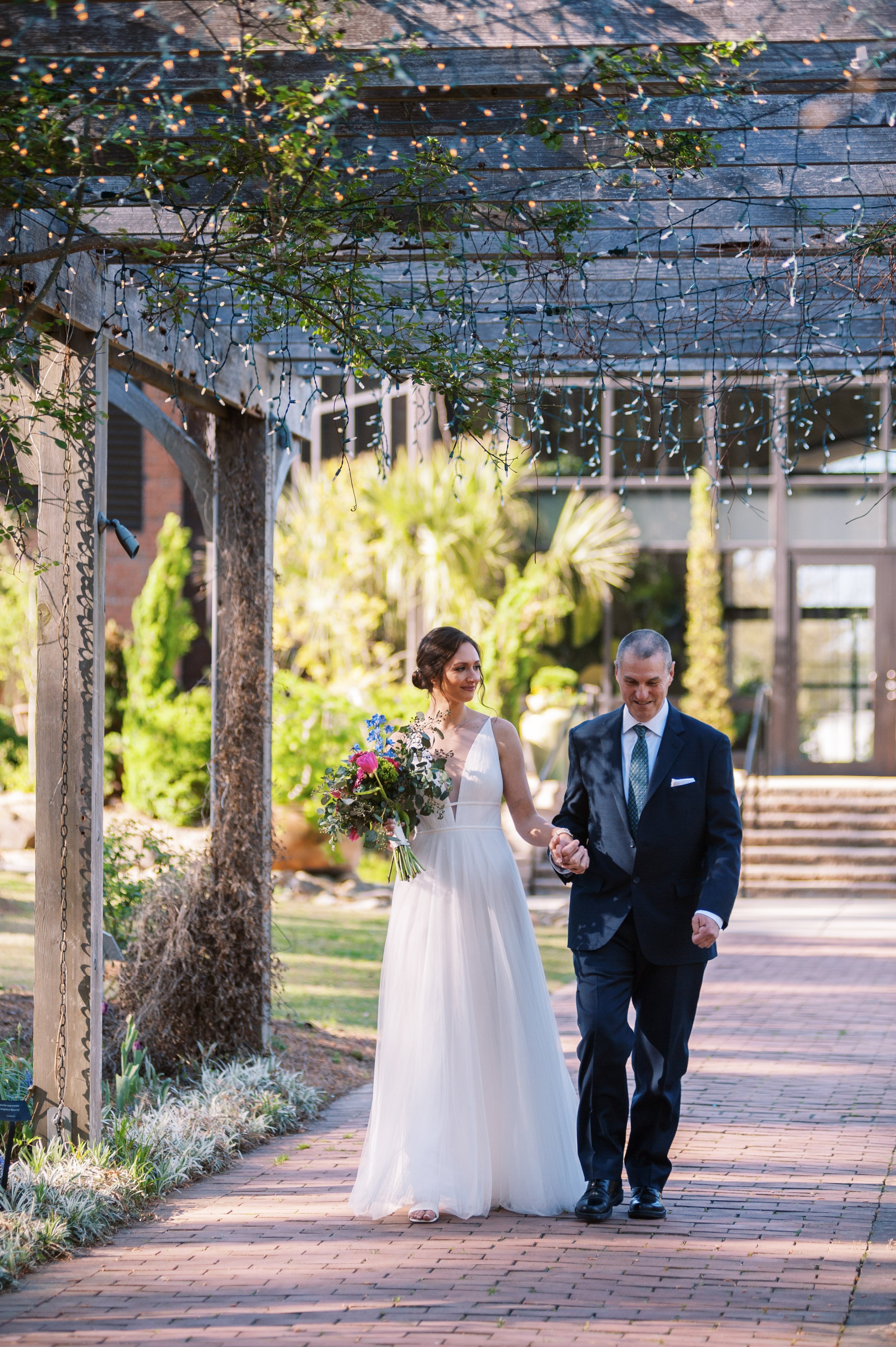 Bride Walks Down Brick Aisle Cape Fear Botanical Garden Wedding Fancy This Photography