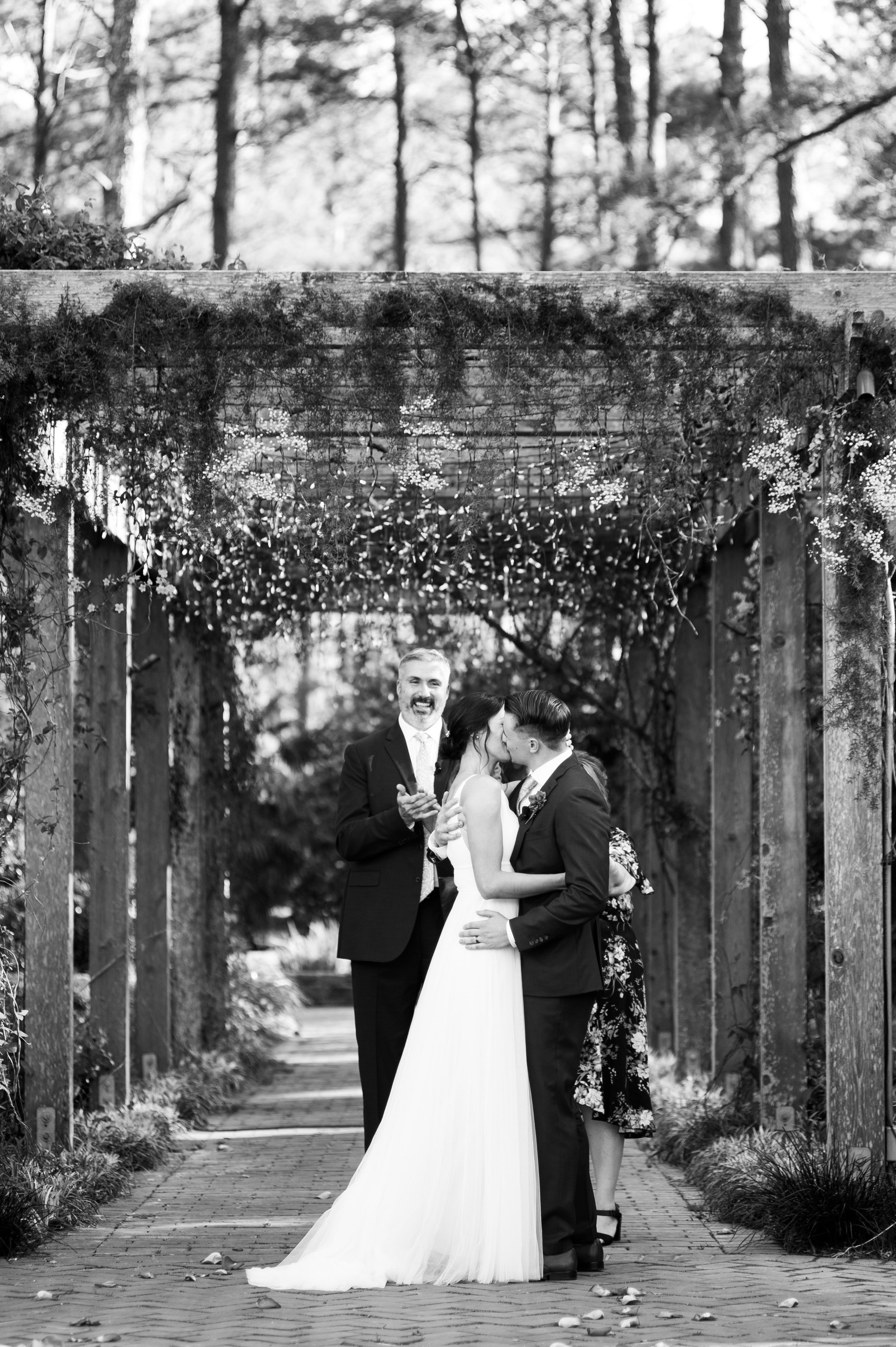 Bride Groom Ceremony Kiss in Cape Fear Botanical Garden wedding. 