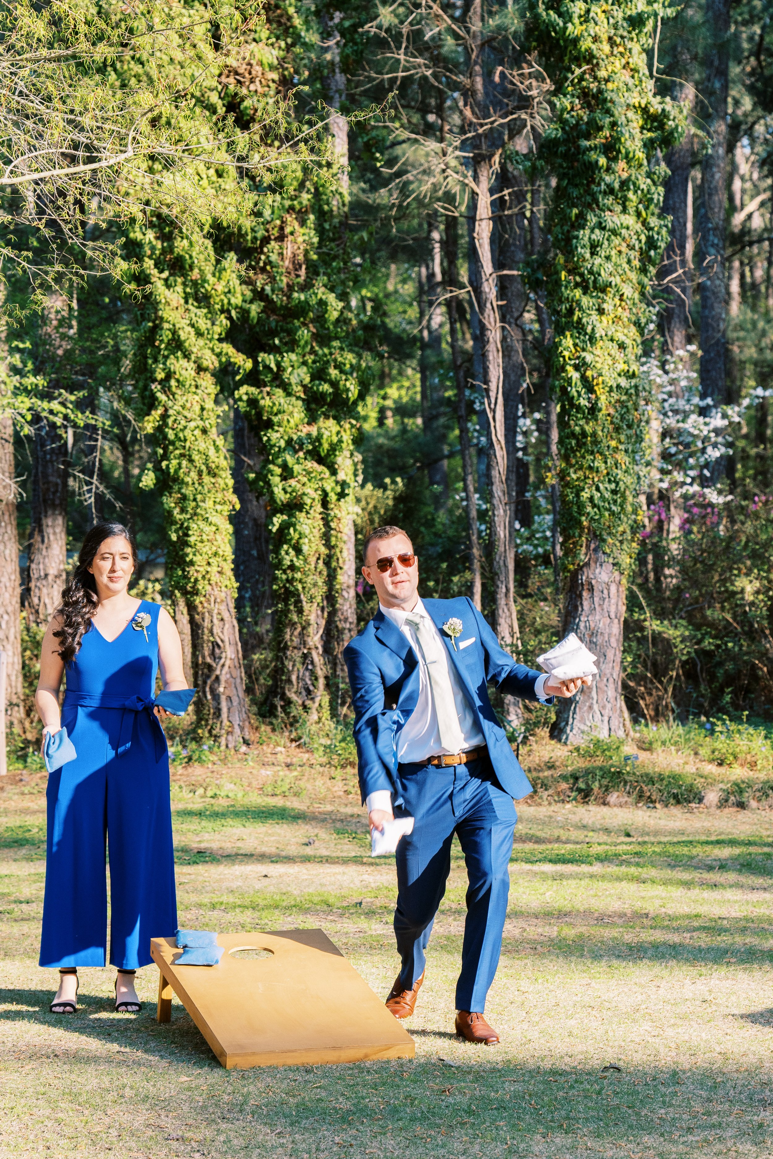 Wedding Guests Play Corn Hole Cocktail Hour Cape Fear Botanical Garden Wedding Fancy This Photography