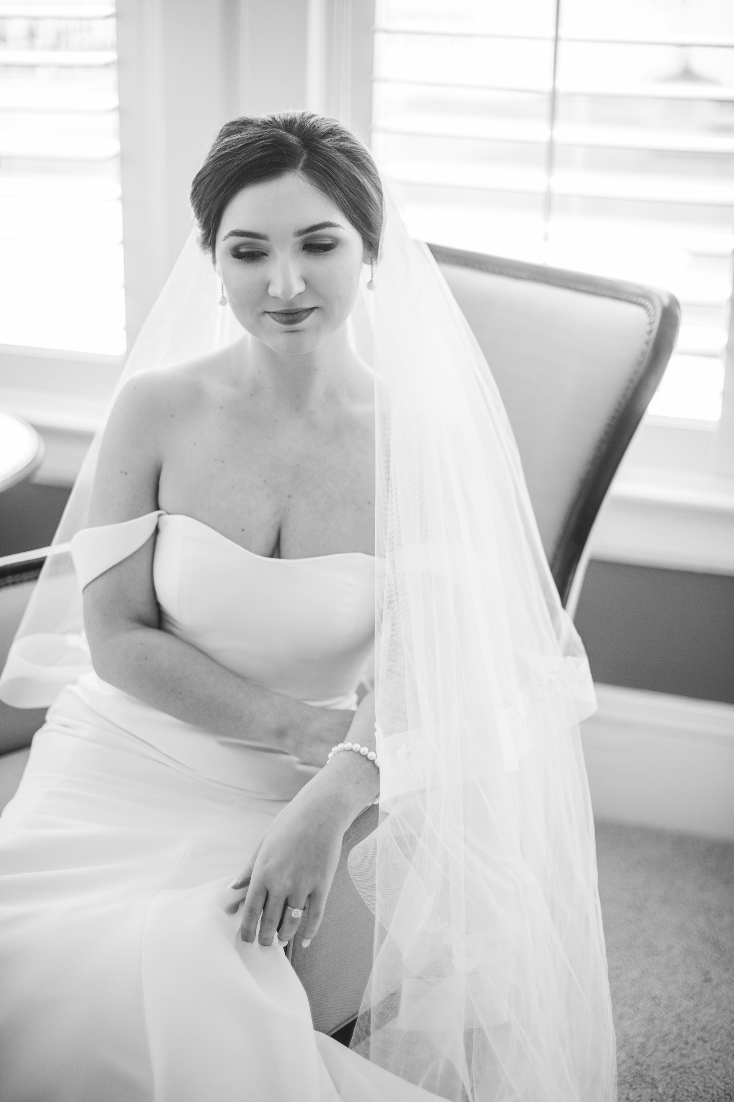 Black and White Southern Bridal Portraits in Chair at River Forest Manor and Marina Fancy This Photography