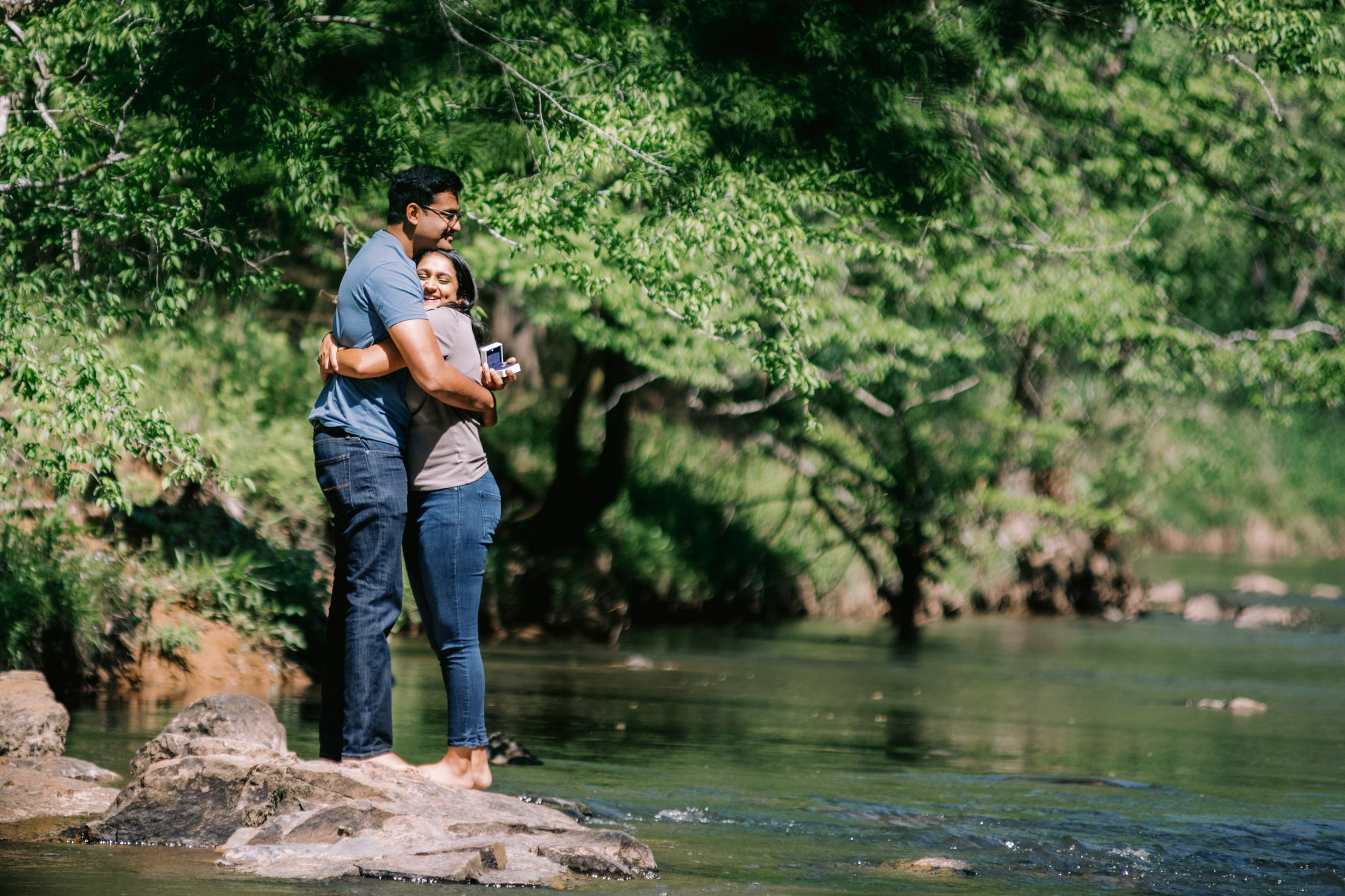 Couple Hugs After Proposal Eno River Engagement Photos Durham NC Fancy This Photography