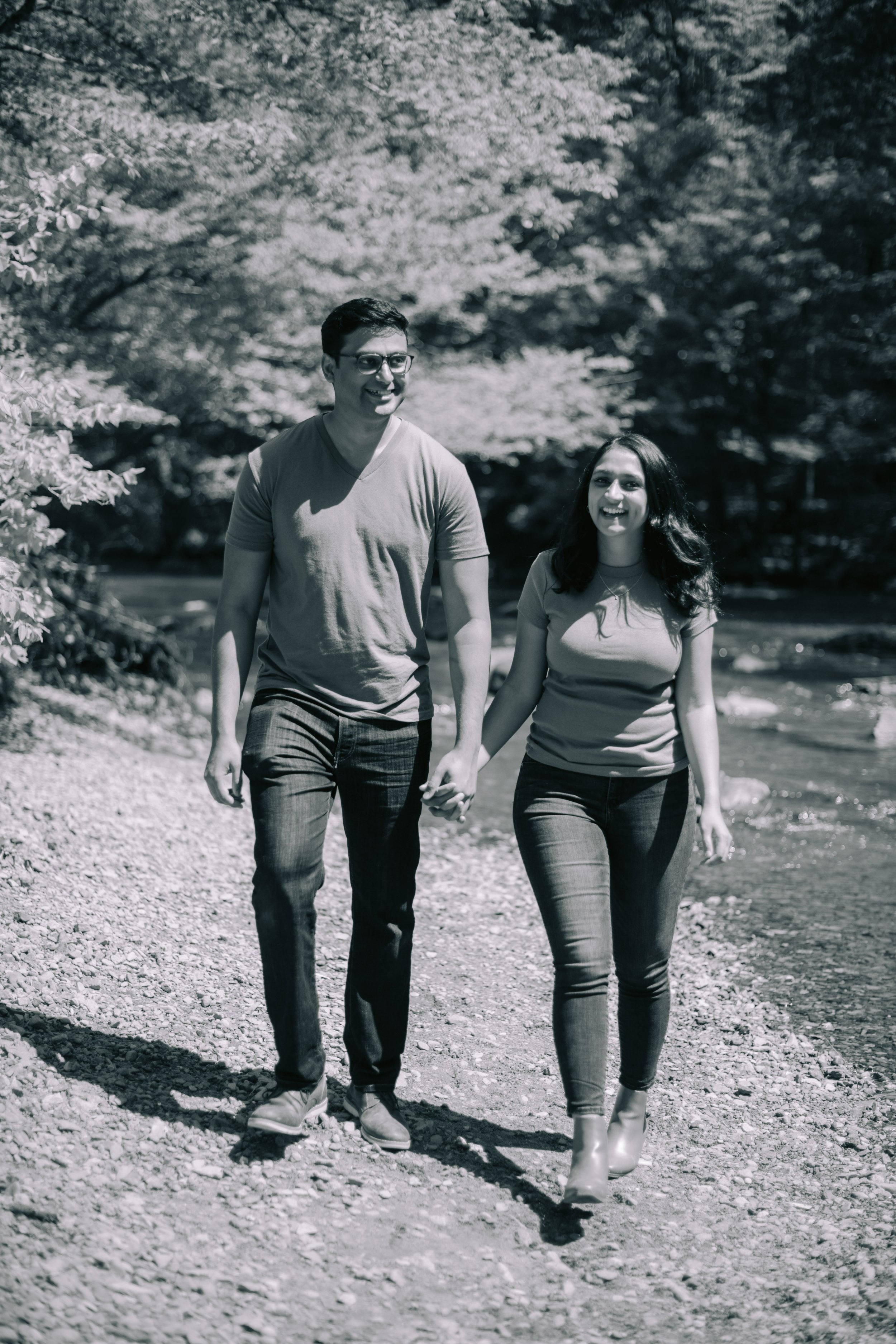 Black and White Image Couple Walking Eno River Engagement Photos Durham NC Fancy This Photography