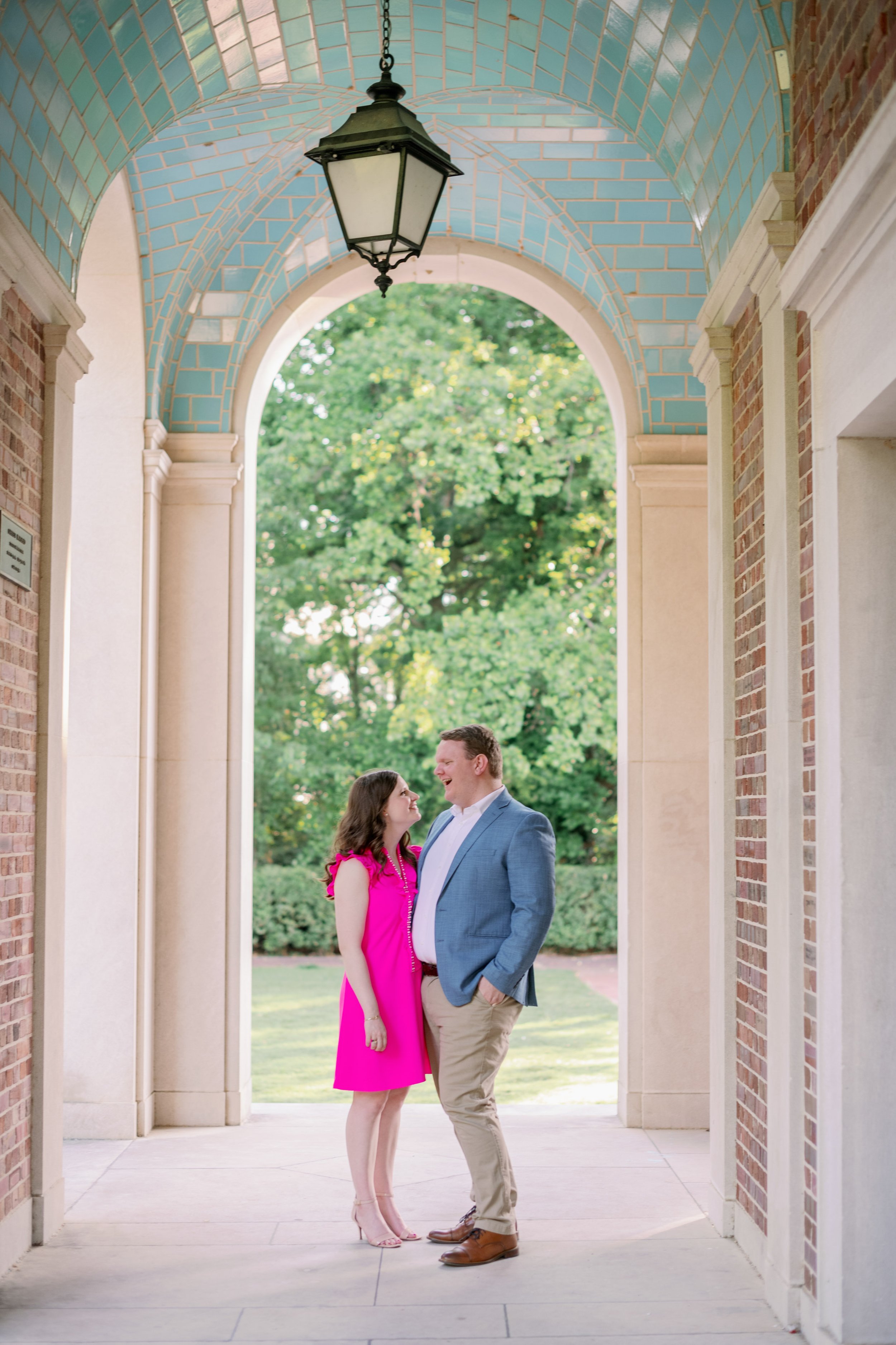 Couple Blue Bell Tower Archway UNC Chapel Hill Engagement Photos Fancy This Photography