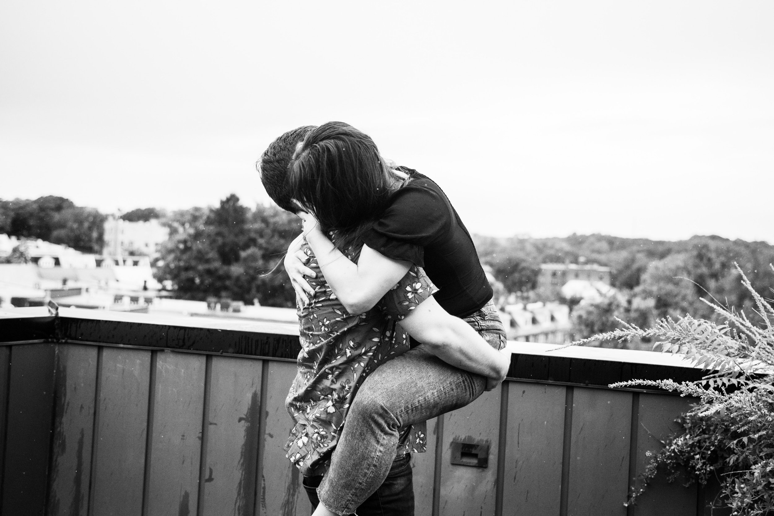Black and White Couple Love on Balcony Washington DC Engagement Photos Fancy This Photography