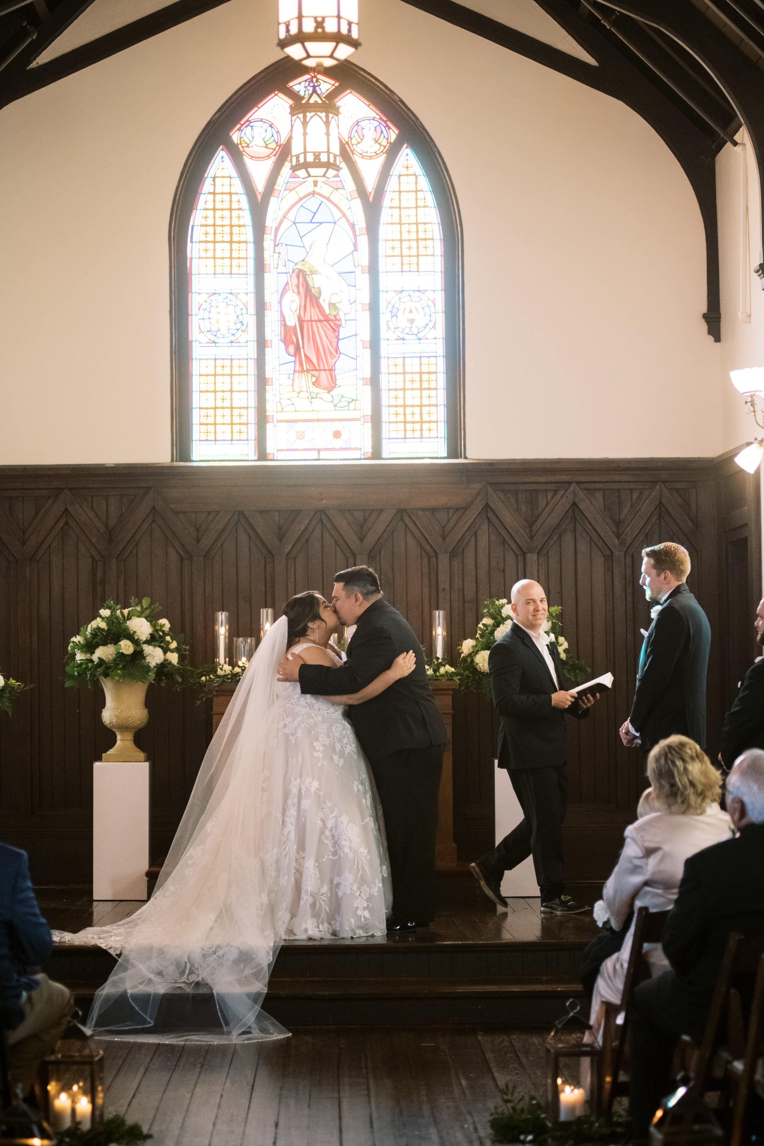 Ceremony Kiss Bride and Groom All Saints Chapel Unique Raleigh Wedding Venue Options Fancy This Photography