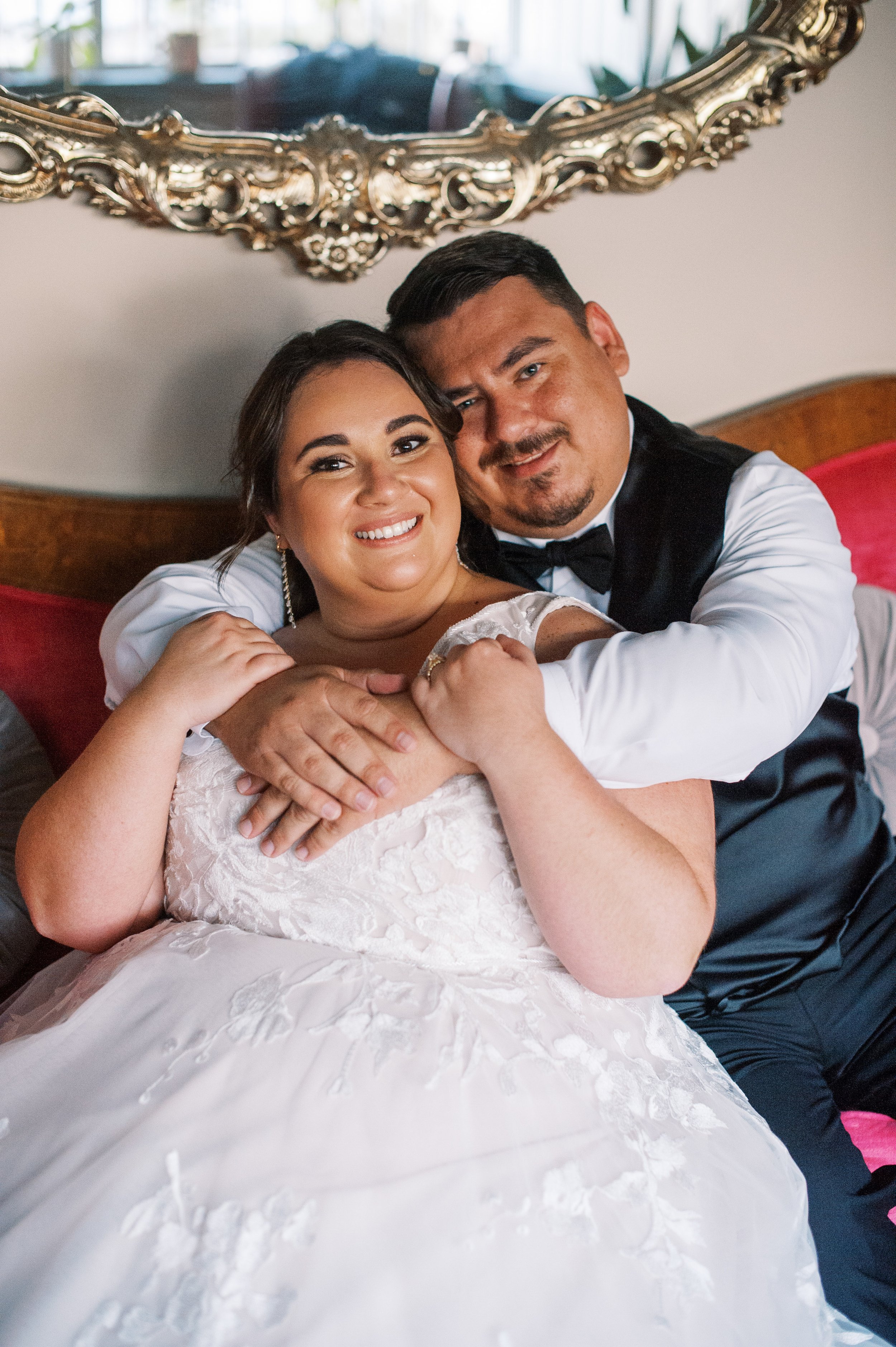 Bride and Groom Sit on Pink Couch Whitaker and Atlantic Unique Raleigh Wedding Venue Options Fancy This Photography