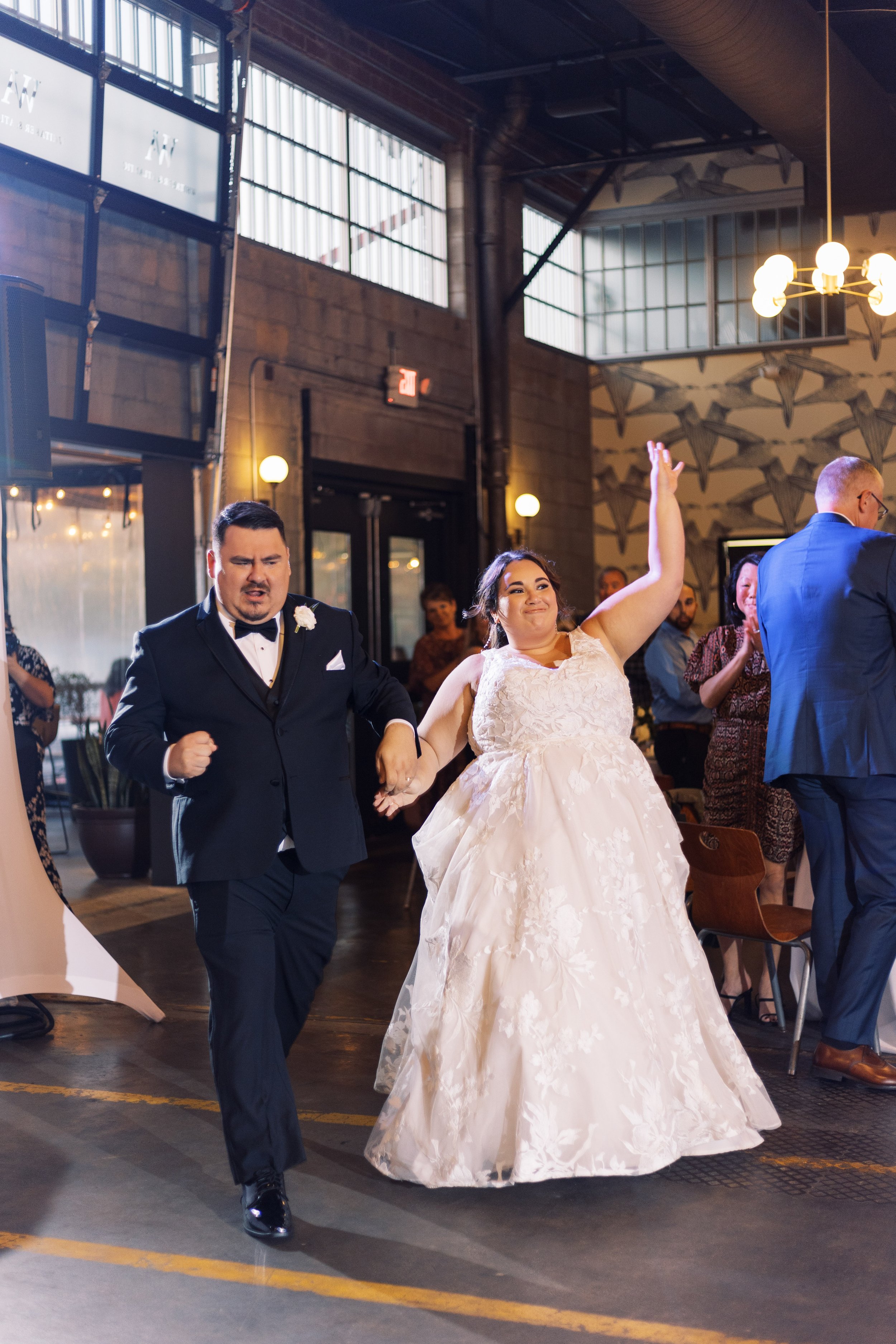 Bride and Groom Enter Modern Reception Whitaker and Atlantic Unique Raleigh Wedding Venue Options Fancy This Photography