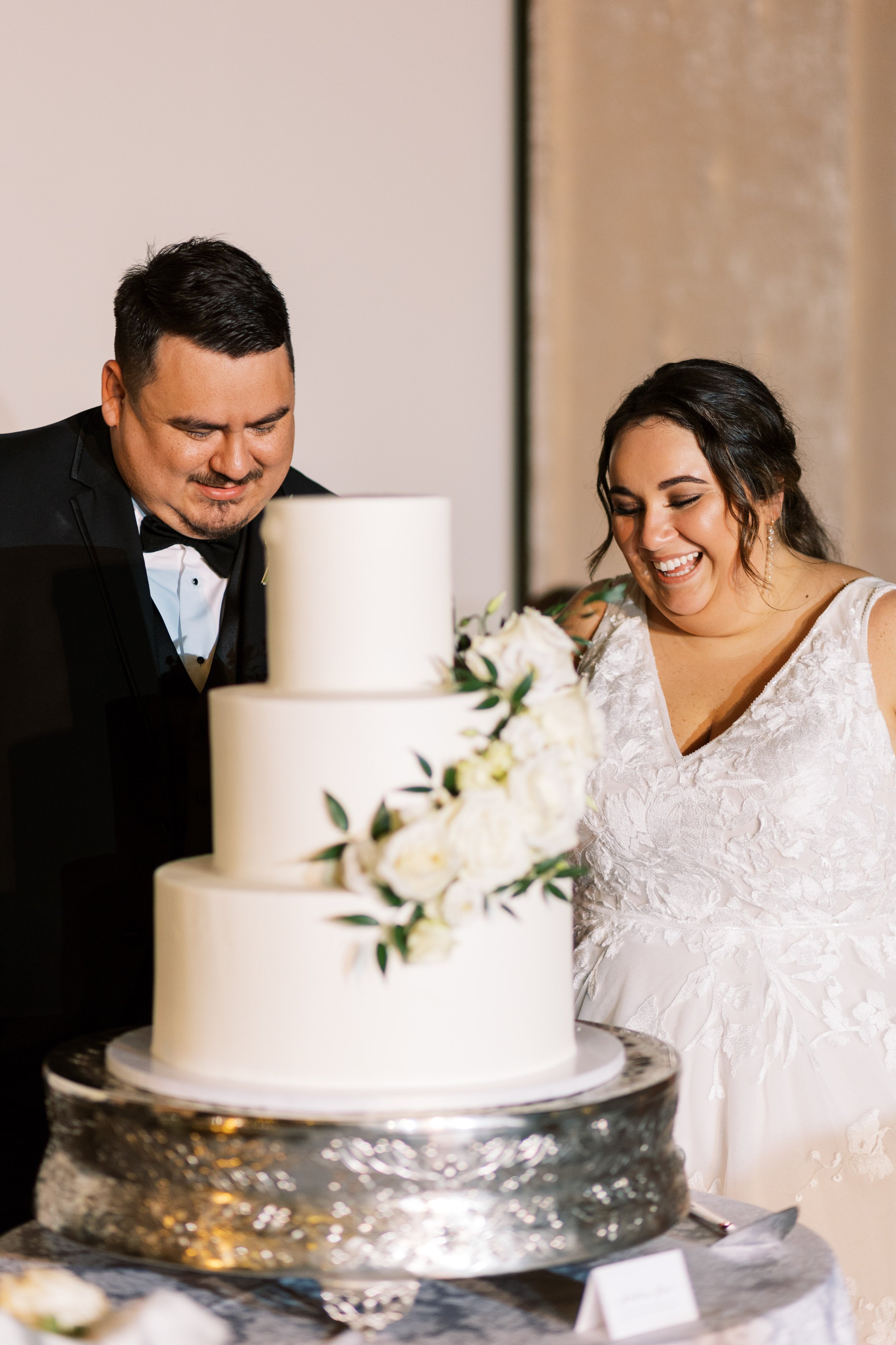 Bride and Groom cut Wedding Cake Whitaker and Atlantic Unique Raleigh Wedding Venue Options Fancy This Photography