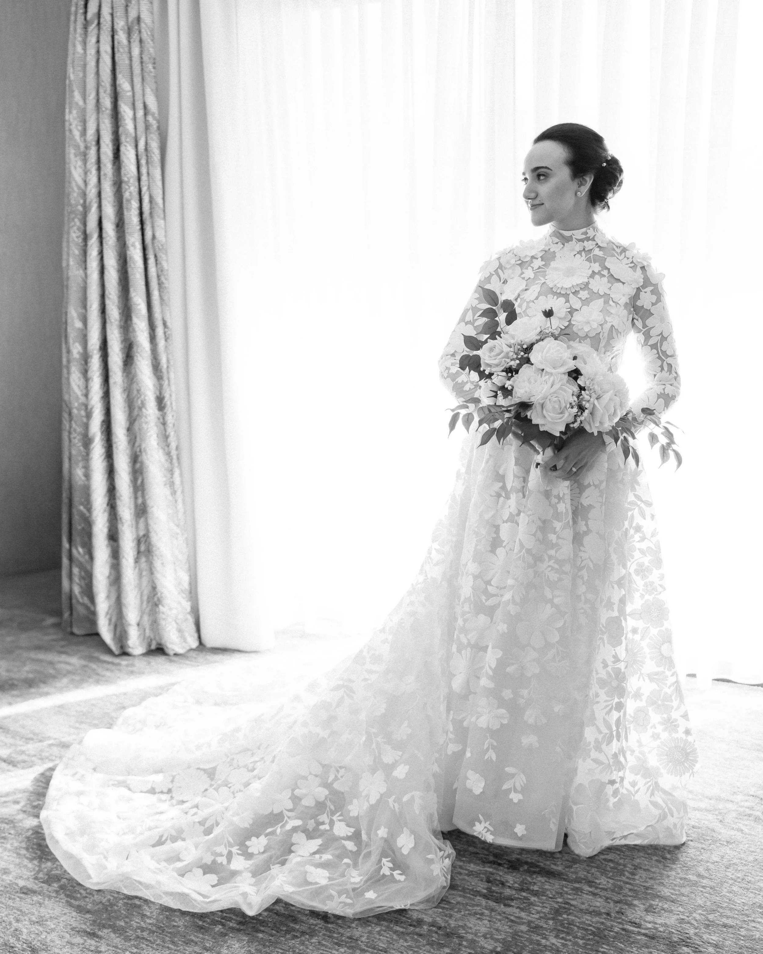 Black and white bridal portrait of a bride in a lace wedding gown at The Umstead Hotel in Cary North Carolina