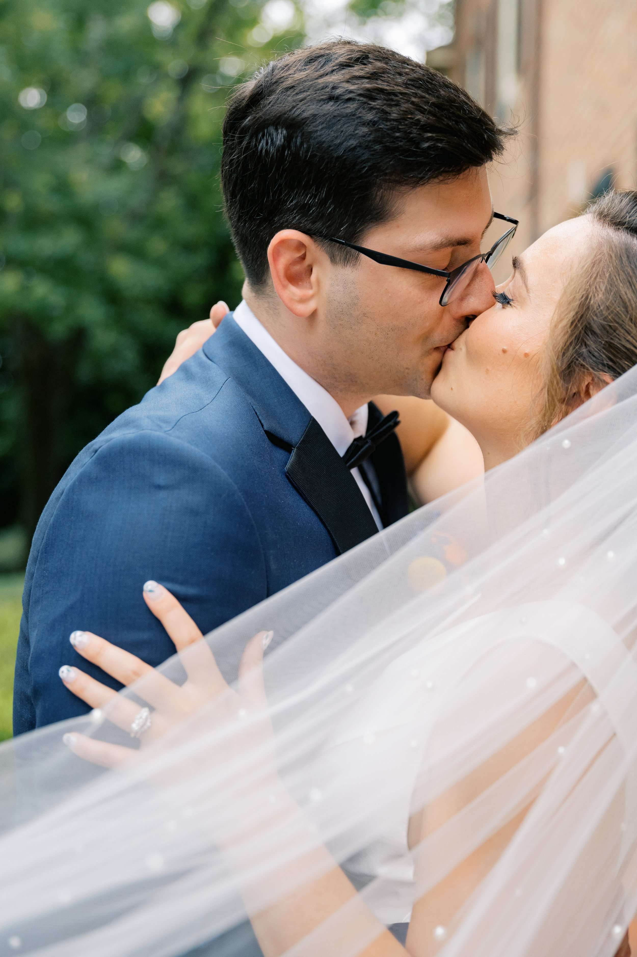 Beautiful Kiss Bride and Groom Outside UNC Chapel Hill Wedding at The Carolina Inn Fancy This Photography
