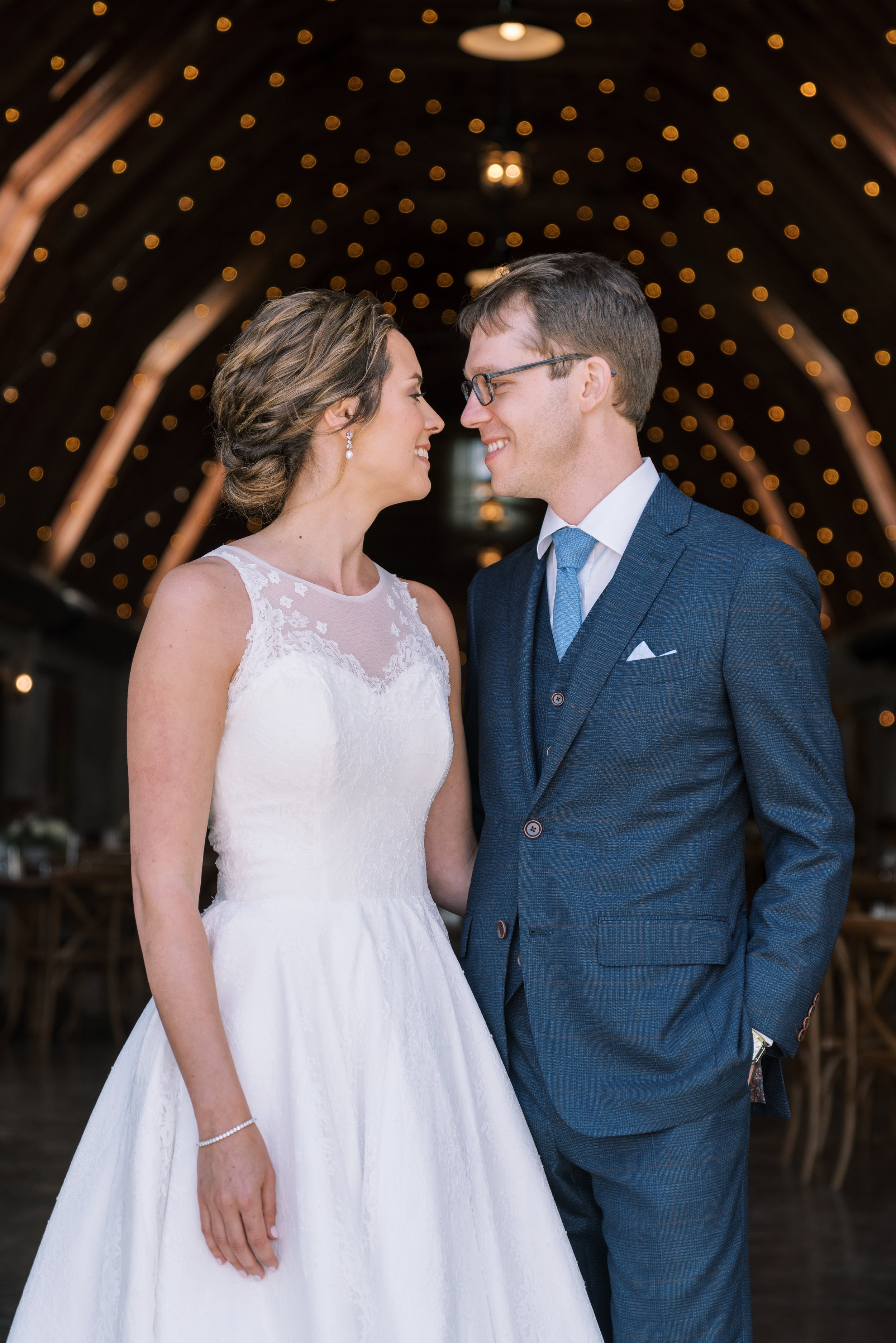 Bride and Groom Barn Door Backlighting Overlook Barn wedding in Banner Elk, NC Fancy This Photography