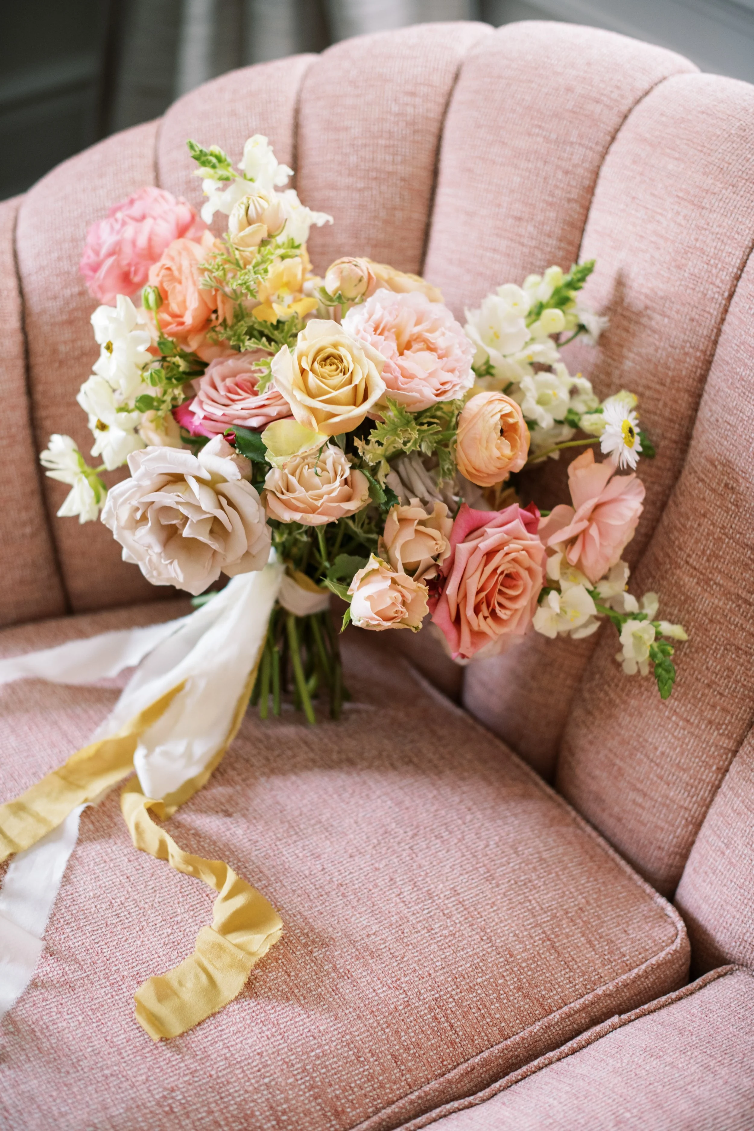 bridal bouquet with ribbon on vintage chair at McAlister-Leftwich House wedding in Greensboro