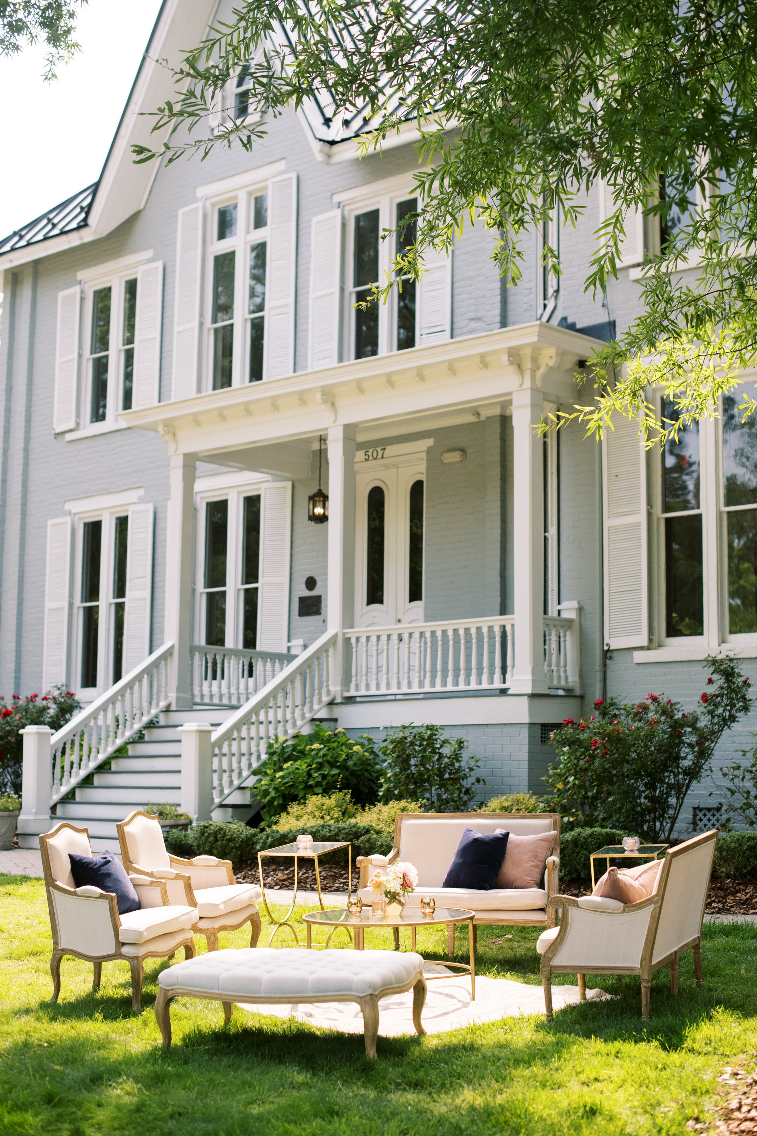 outdoor wedding lounge setup in front of McAlister-Leftwich House in Greensboro NC