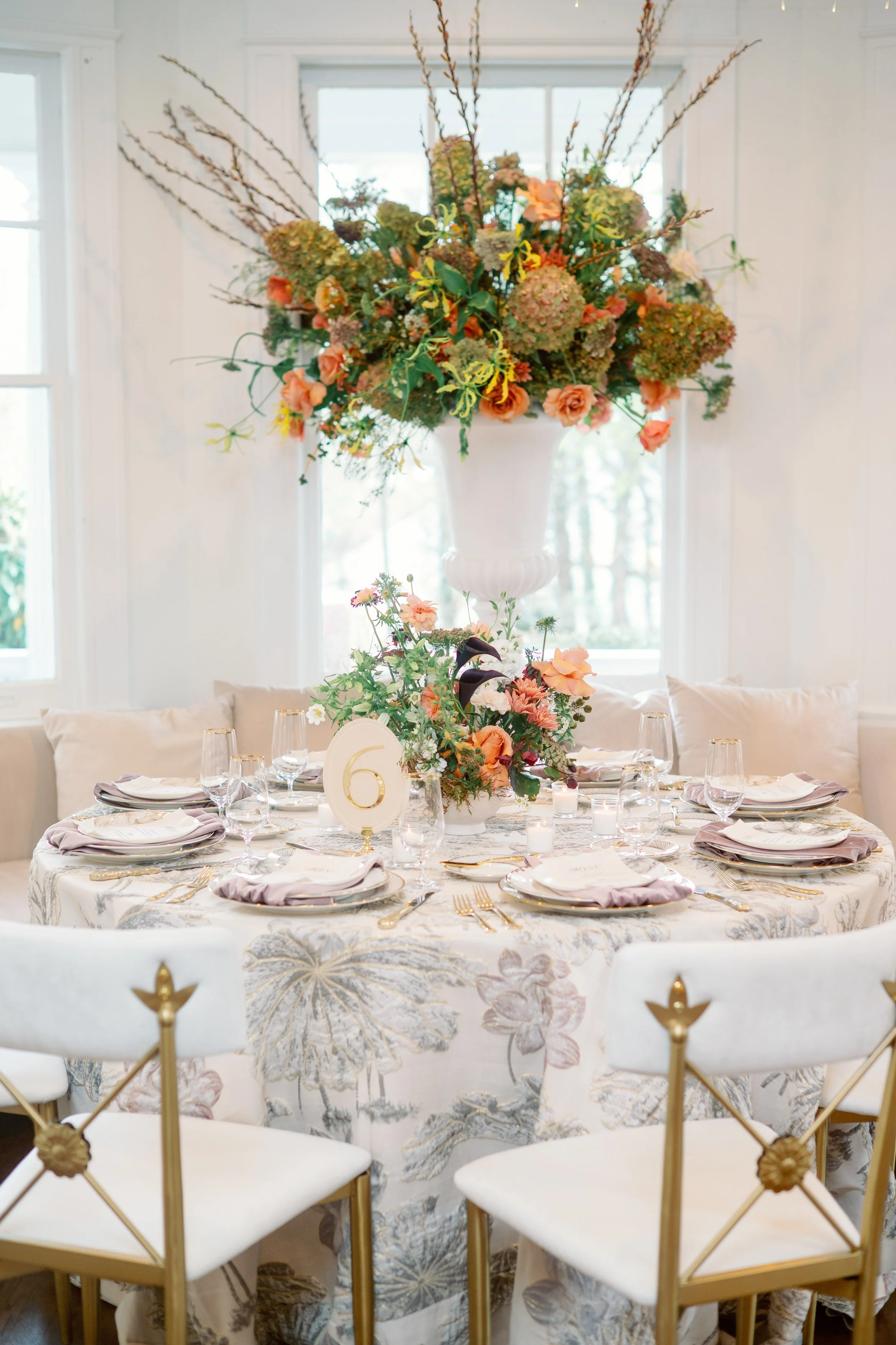 tall floral centerpiece on reception table at McAlister-Leftwich House in Greensboro North Carolina