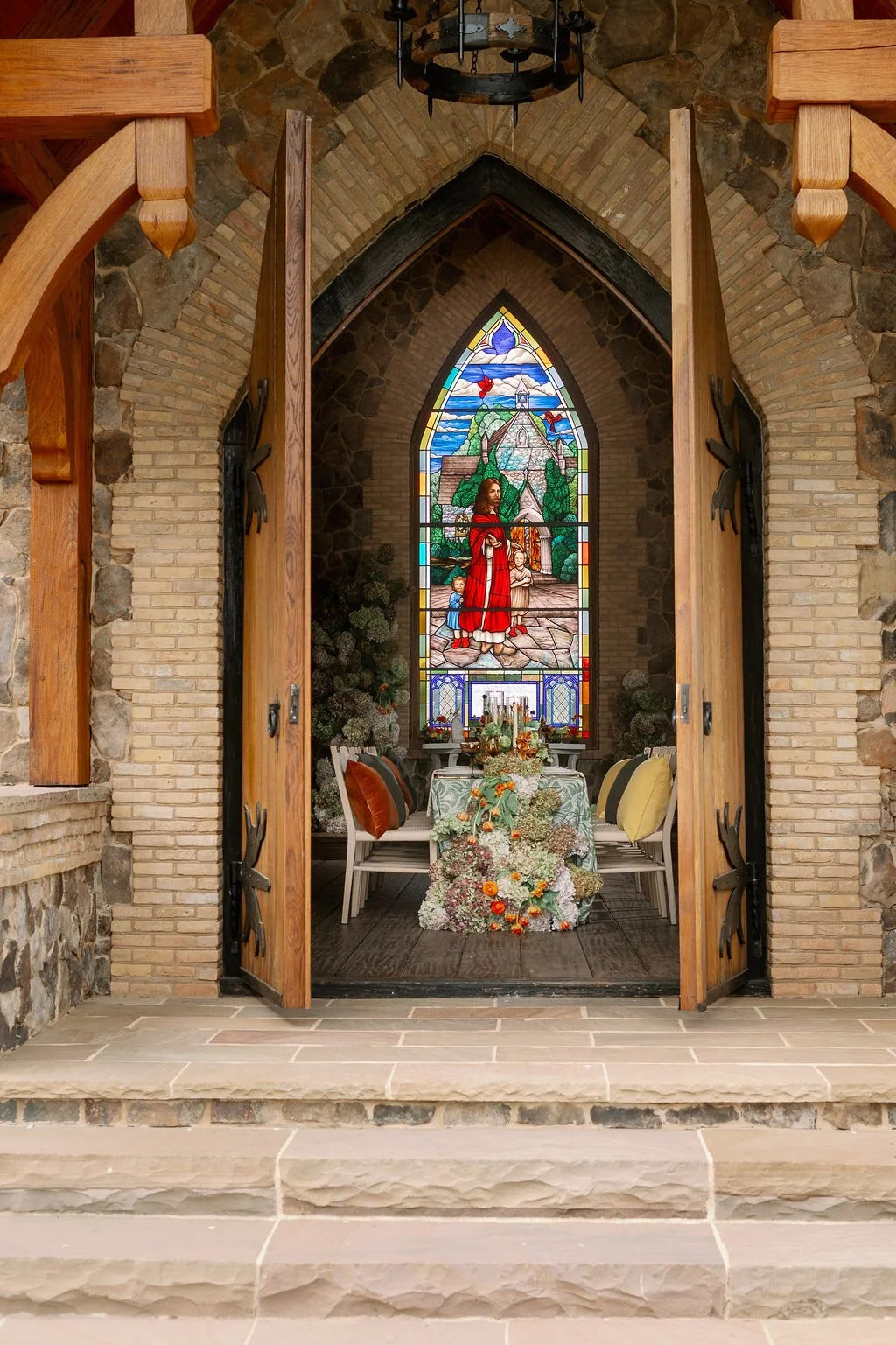  Open chapel doors revealing the stained glass window inside The Little Chapel at Haven Ridge in Winston-Salem 